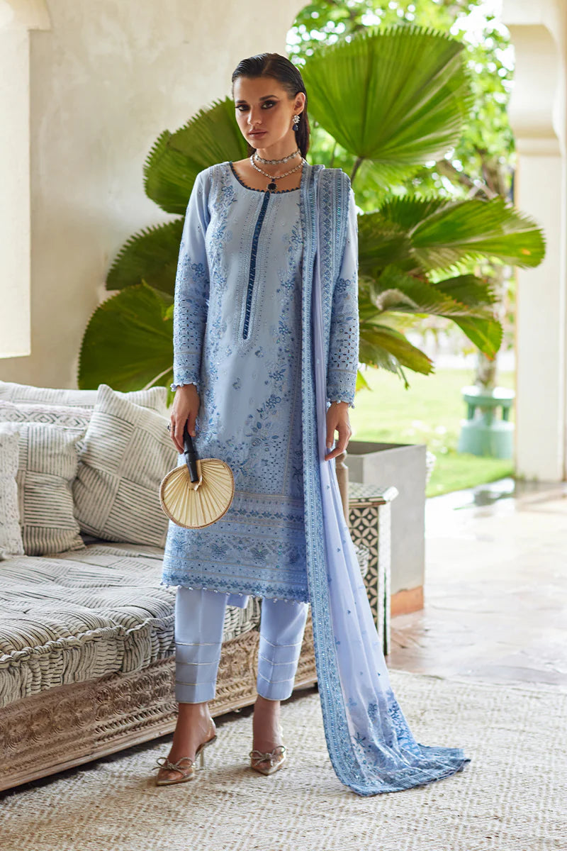 Model wearing Gulaal AZALEA blue luxury lawn dress with intricate embroidery. Shop Pakistani luxury pret online in the UK for timeless elegance.