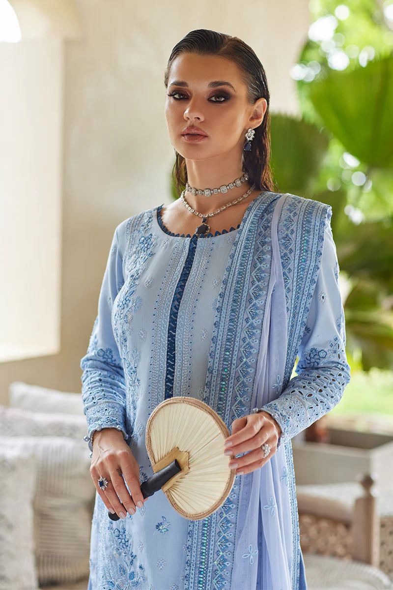 Model wearing Gulaal AZALEA blue luxury lawn dress with intricate embroidery. Shop Pakistani luxury pret online in the UK for timeless elegance.