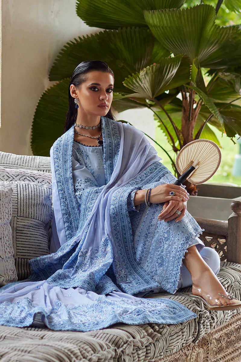 Model wearing Gulaal AZALEA blue luxury lawn dress with intricate embroidery. Shop Pakistani luxury pret online in the UK for timeless elegance.