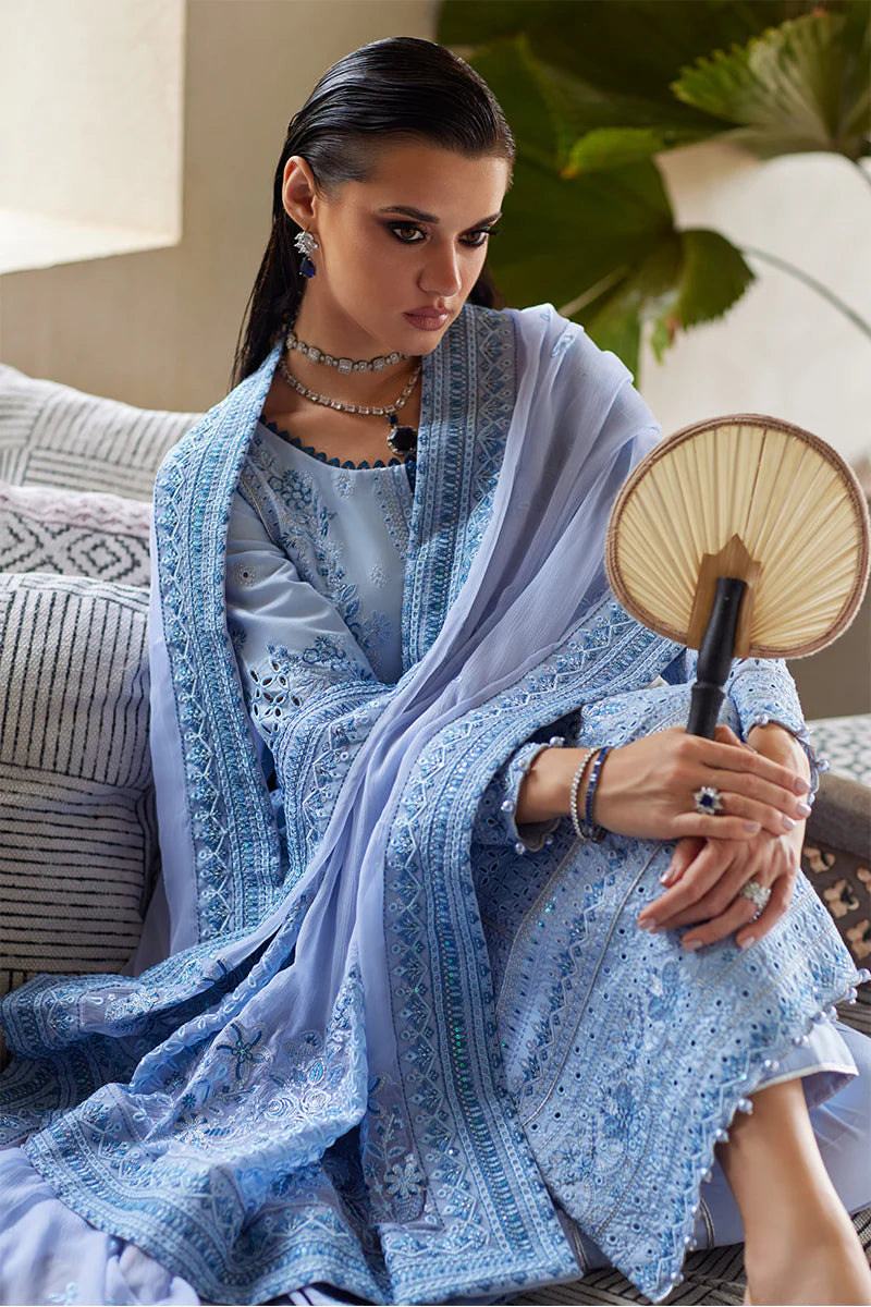 Model wearing Gulaal AZALEA blue luxury lawn dress with intricate embroidery. Shop Pakistani luxury pret online in the UK for timeless elegance.