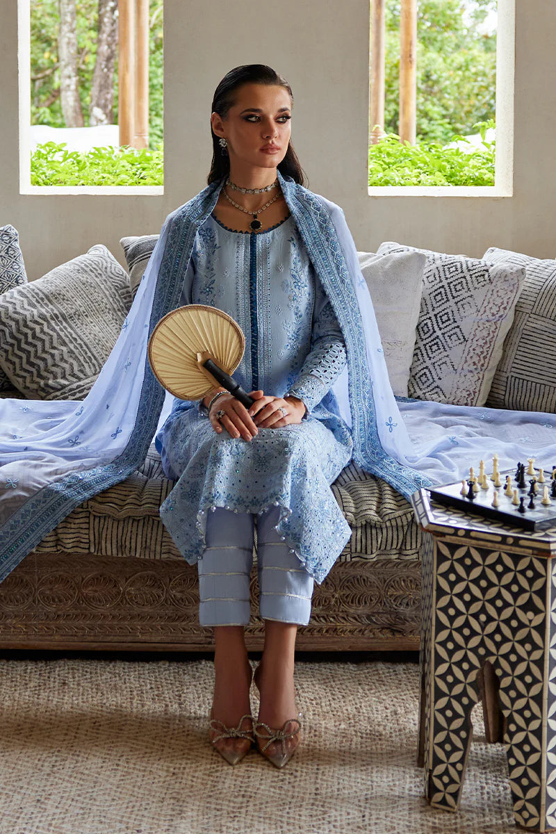 Model wearing Gulaal AZALEA blue luxury lawn dress with intricate embroidery. Shop Pakistani luxury pret online in the UK for timeless elegance.