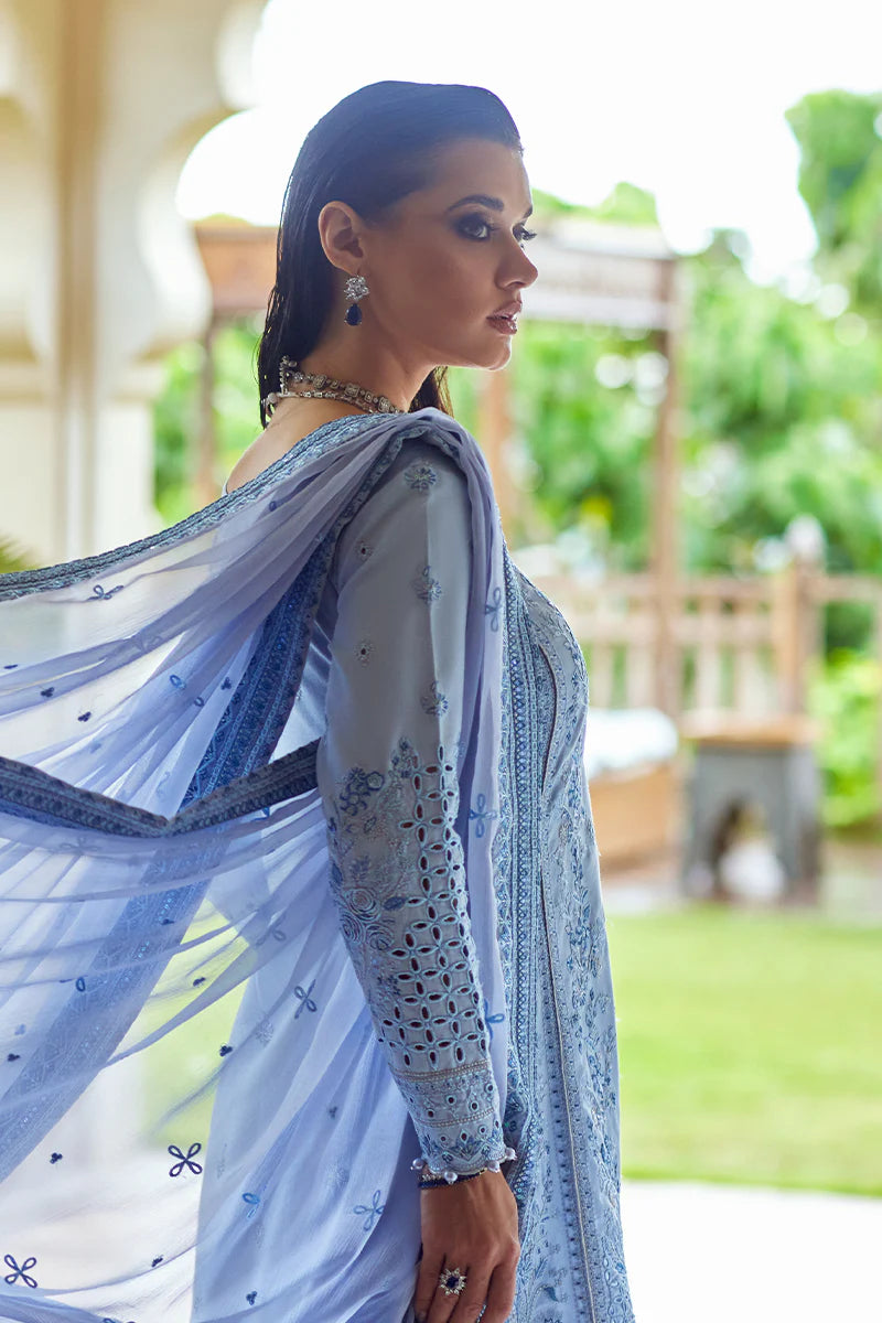 Model wearing Gulaal AZALEA blue luxury lawn dress with intricate embroidery. Shop Pakistani luxury pret online in the UK for timeless elegance.