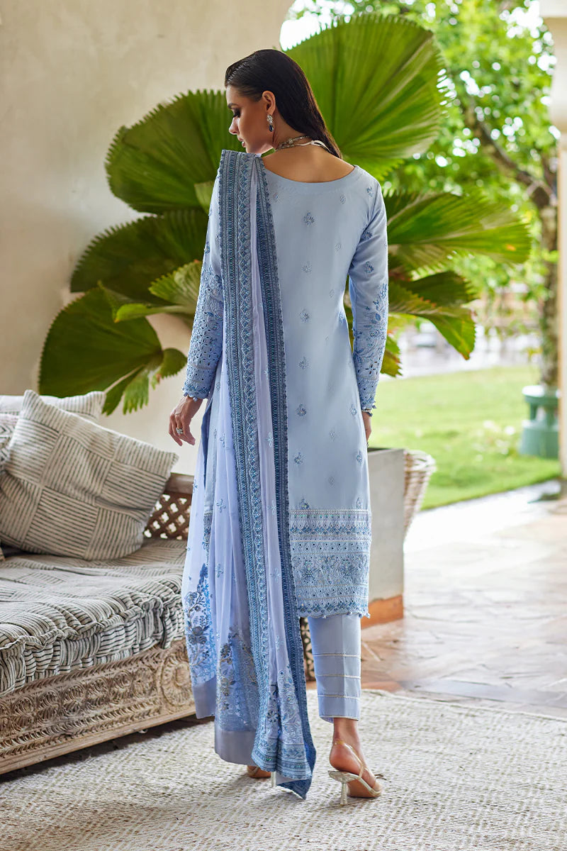 Model wearing Gulaal AZALEA blue luxury lawn dress with intricate embroidery. Shop Pakistani luxury pret online in the UK for timeless elegance.