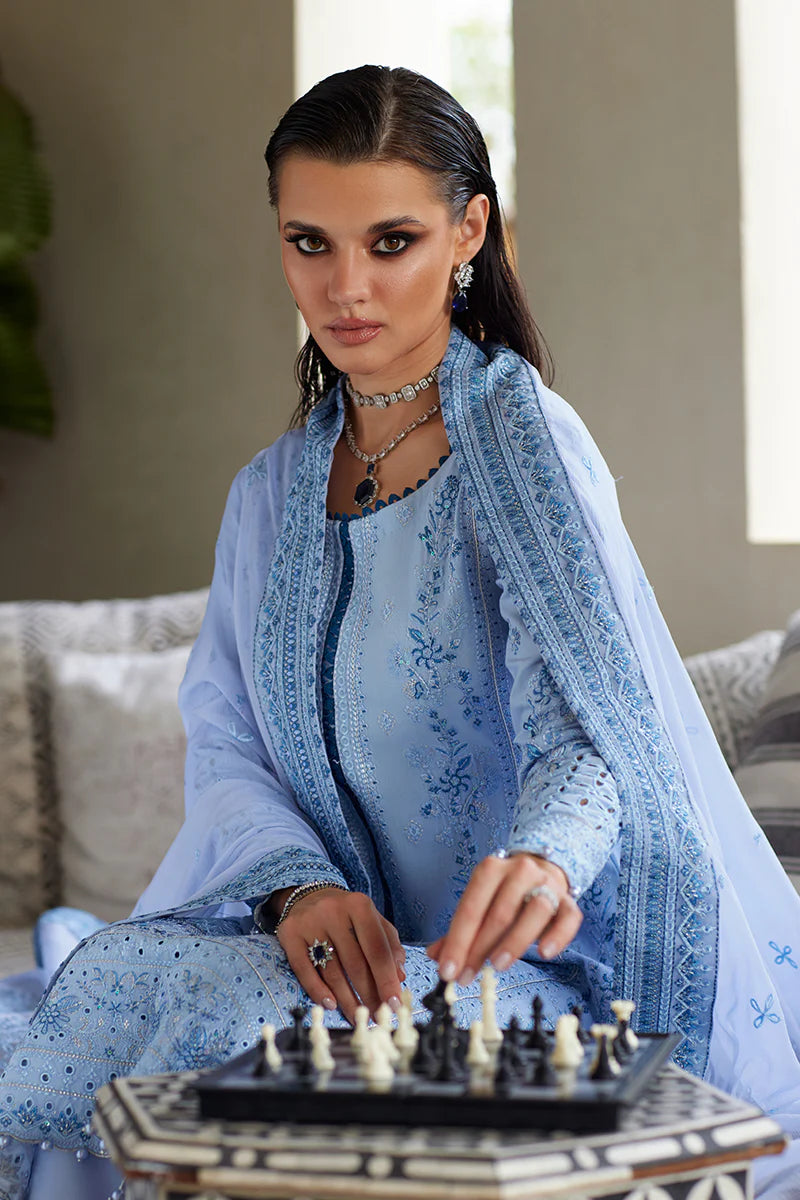 Model wearing Gulaal AZALEA blue luxury lawn dress with intricate embroidery. Shop Pakistani luxury pret online in the UK for timeless elegance.