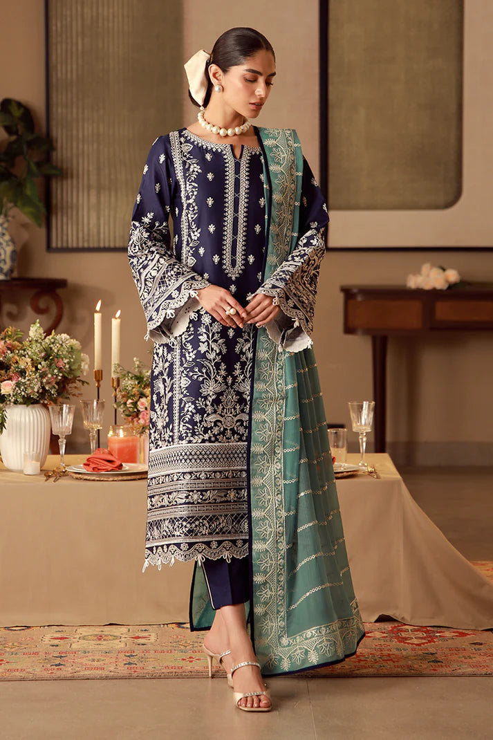 Model wearing navy blue Gulaal Ziya outfit with intricate white embroidery and green dupatta, perfect for Pakistani luxury pret in the UK.
