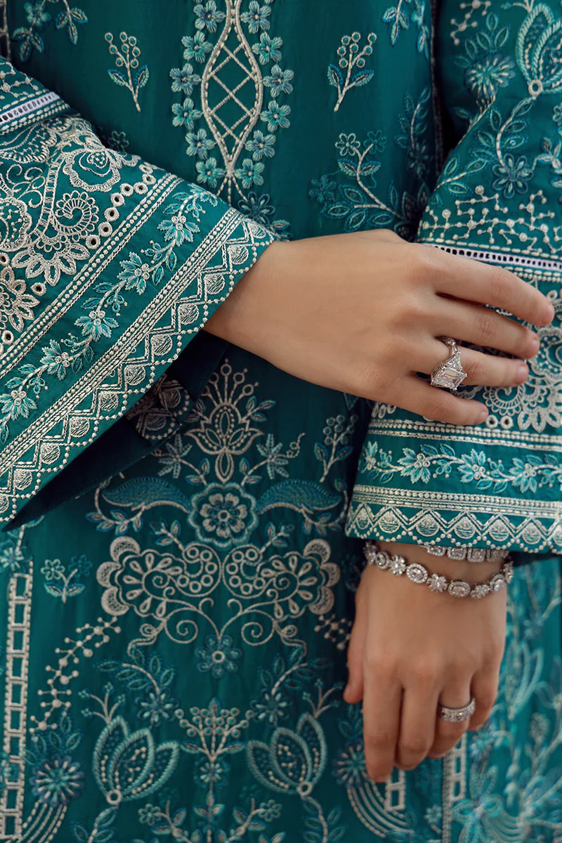 Model wearing teal Gulaal Ariana outfit with white thread embroidery, perfect for Pakistani luxury pret and festive wear online in the UK.