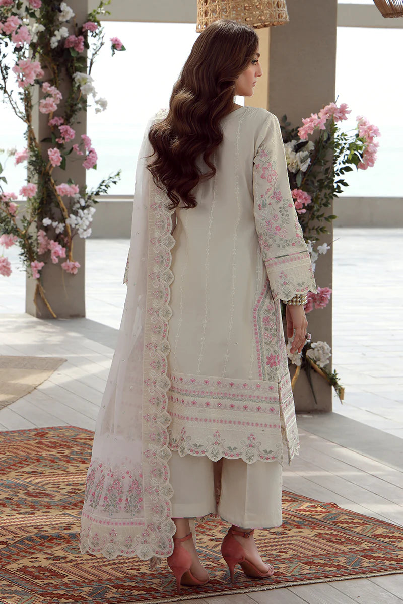 Model wearing off-white and pink embroidered Gulaal Kaia suit, perfect for Eid celebrations and Pakistani luxury pret online in UK.