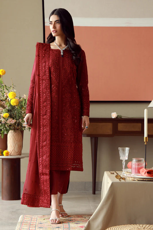 Model wearing deep red embroidered Gulaal Ella outfit, ideal for festive wear and Pakistani luxury pret available online in the UK.