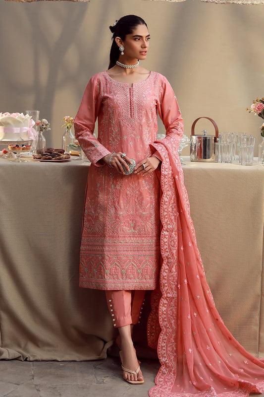 Model wearing coral pink embroidered Ira outfit from Gulaal Festive Pret, perfect for Pakistani luxury pret and Eid fashion in the UK.