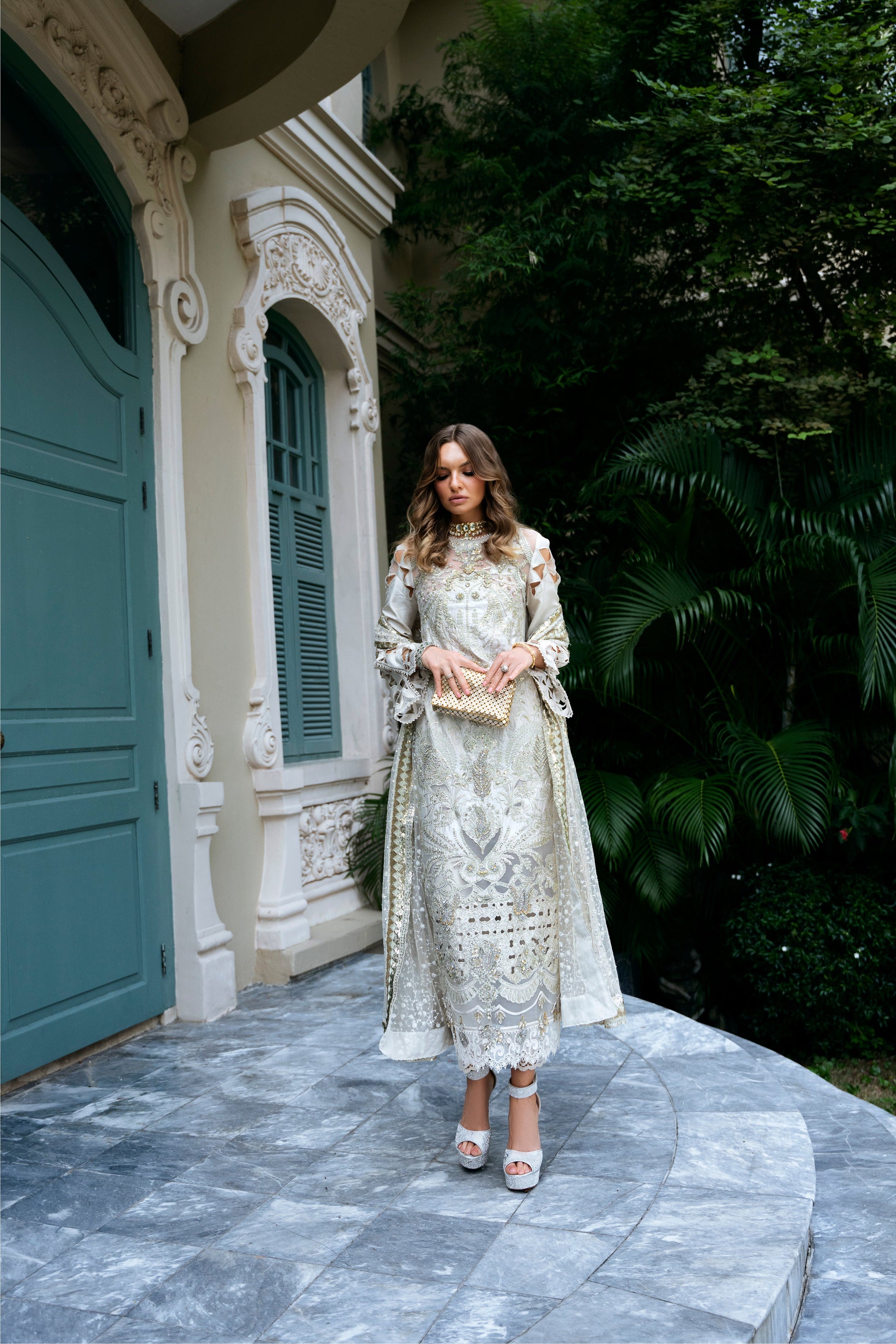 Model wearing Helena dress from Mysie by Tahira in a soft gold color, perfect for Pakistani luxury pret and online shopping in the UK.