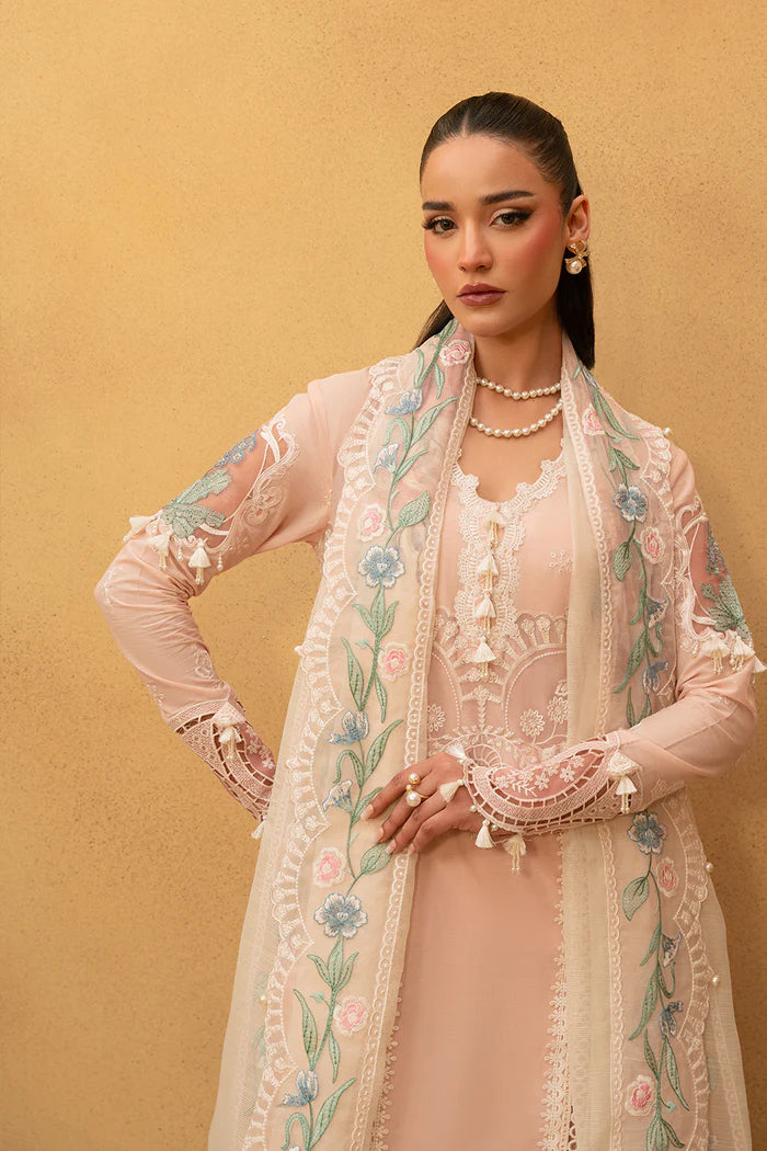 Model wearing soft peach embroidered dress with floral organza dupatta from Saira Rizwan, Pakistani luxury pret, Pakistani clothes online in UK.