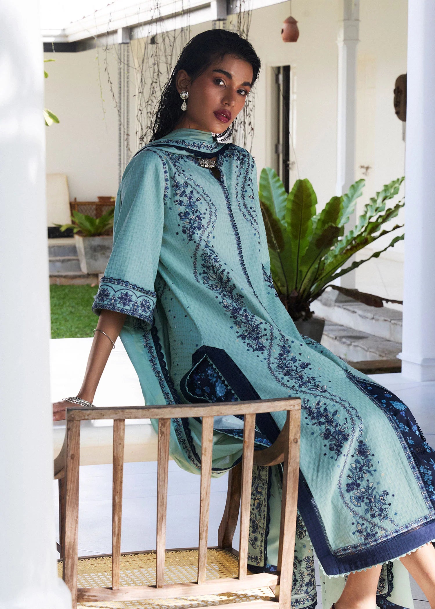 Model wearing light turquoise and navy embroidered Nesta outfit from Hussain Rehar Pret SS '25, Pakistani luxury pret and clothes online in UK.