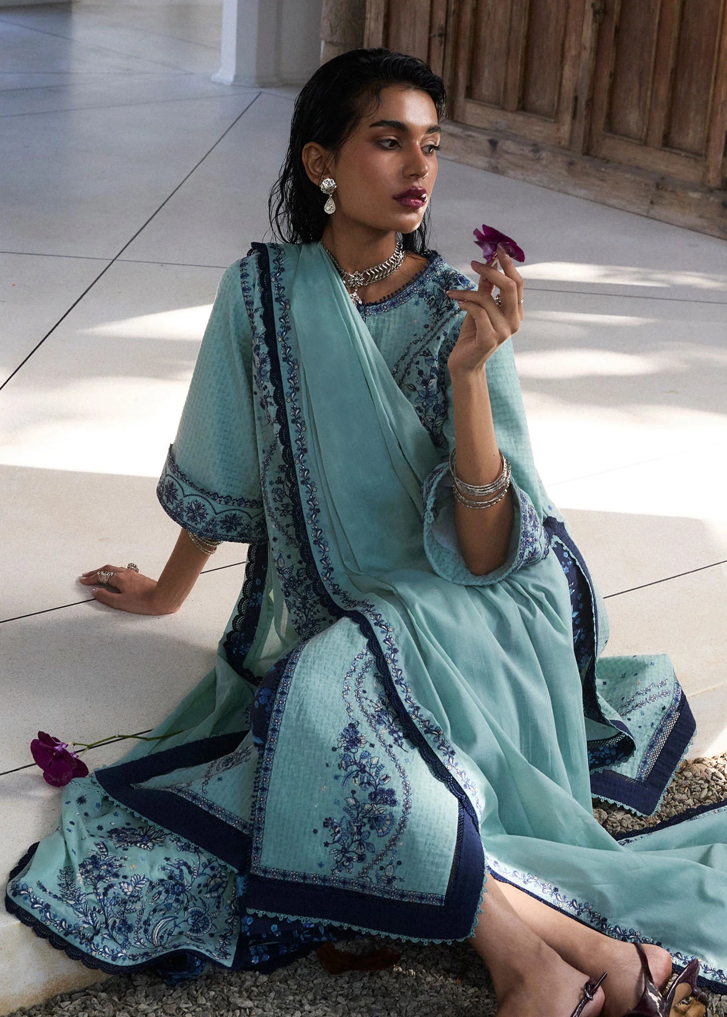 Model wearing light turquoise and navy embroidered Nesta outfit from Hussain Rehar Pret SS '25, Pakistani luxury pret and clothes online in UK.