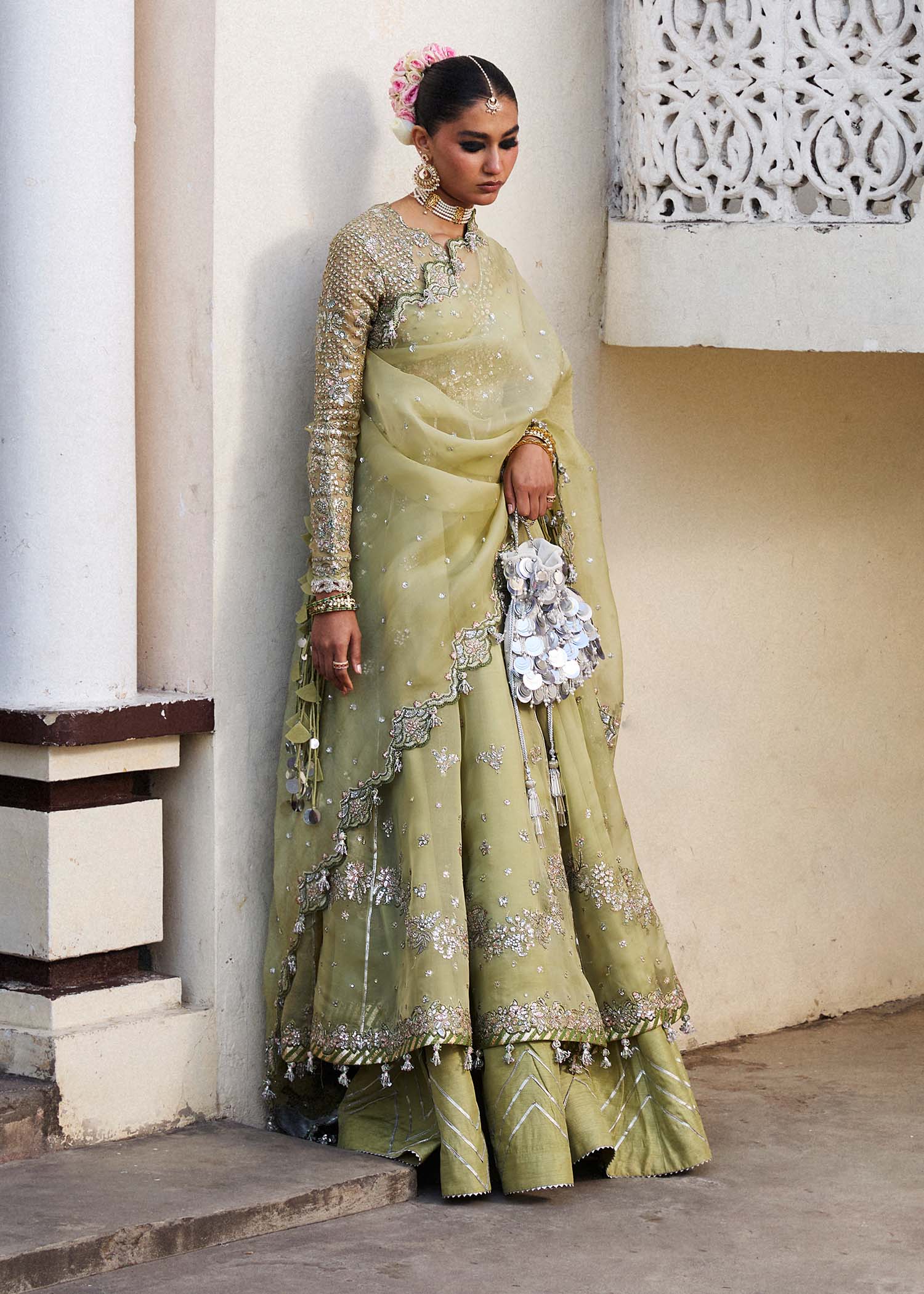 Model wearing Hussain Rehar Tahiri pastel green embroidered festive dress. Shop Pakistani clothes online in the UK for luxury occasion wear.
