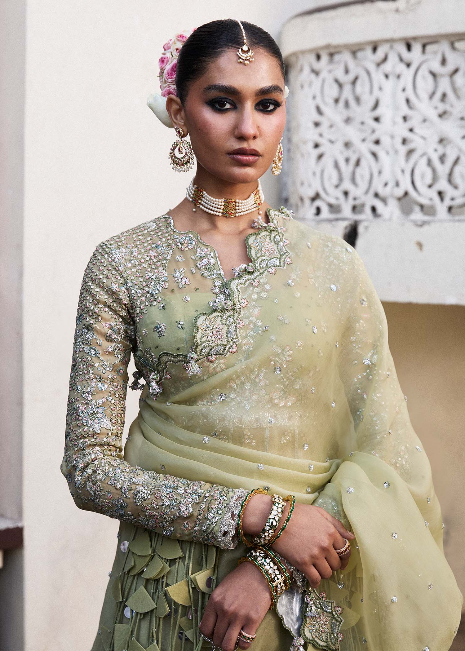 Model wearing Hussain Rehar Tahiri pastel green embroidered festive dress. Shop Pakistani clothes online in the UK for luxury occasion wear.
