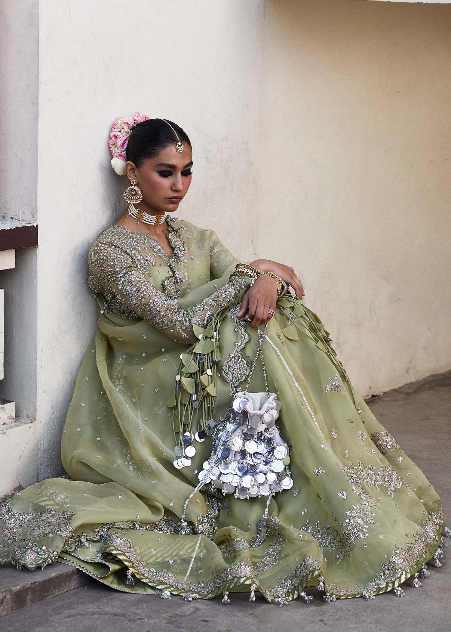 Model wearing Hussain Rehar Tahiri pastel green embroidered festive dress. Shop Pakistani clothes online in the UK for luxury occasion wear.
