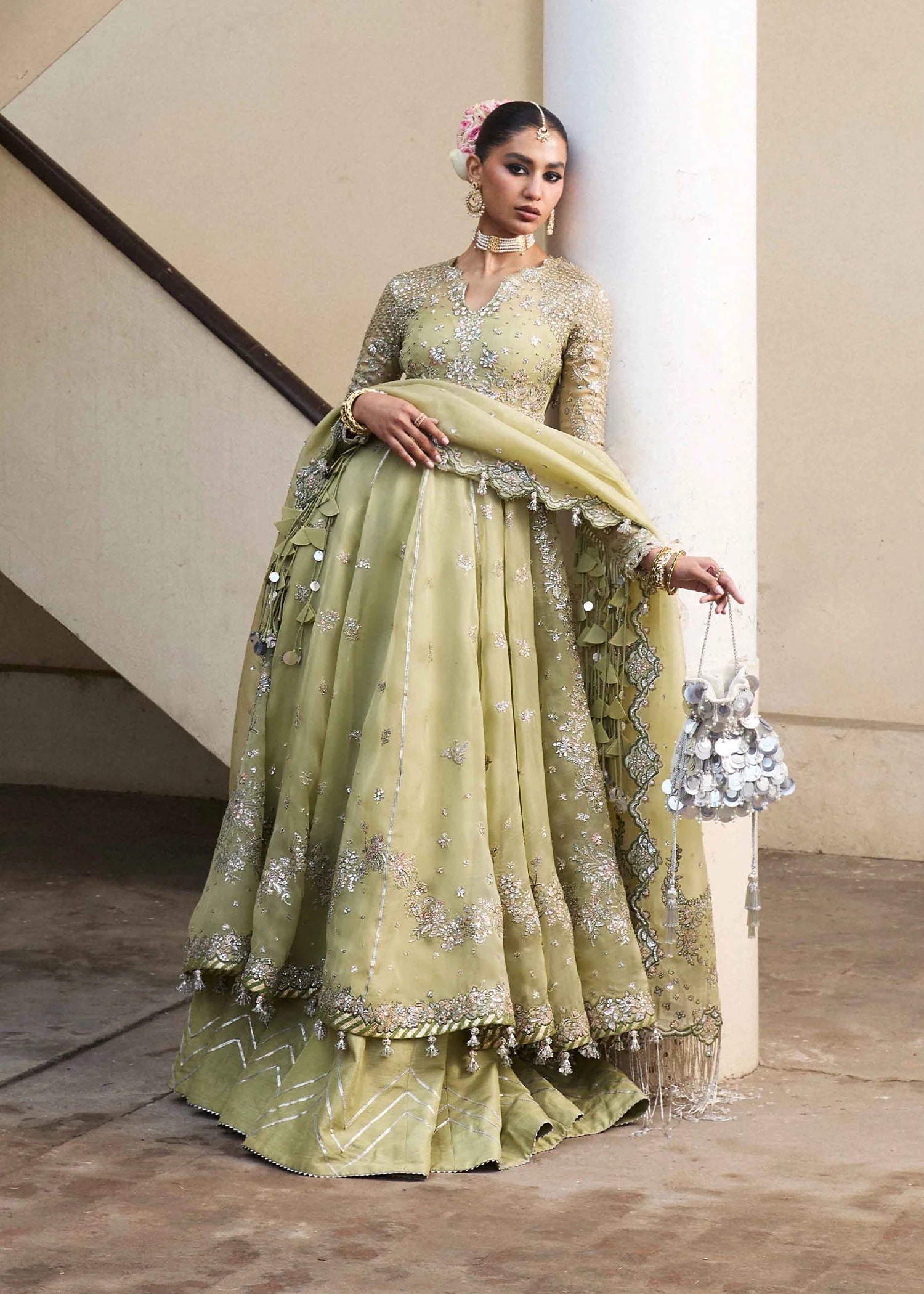 Model wearing Hussain Rehar Tahiri pastel green embroidered festive dress. Shop Pakistani clothes online in the UK for luxury occasion wear.
