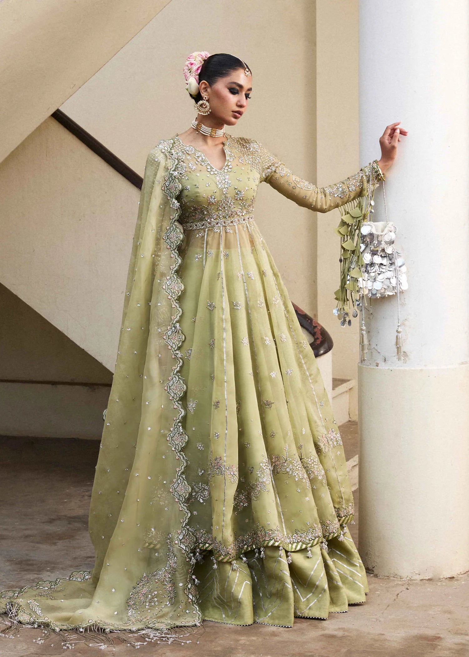 Model wearing Hussain Rehar Tahiri pastel green embroidered festive dress. Shop Pakistani clothes online in the UK for luxury occasion wear.
