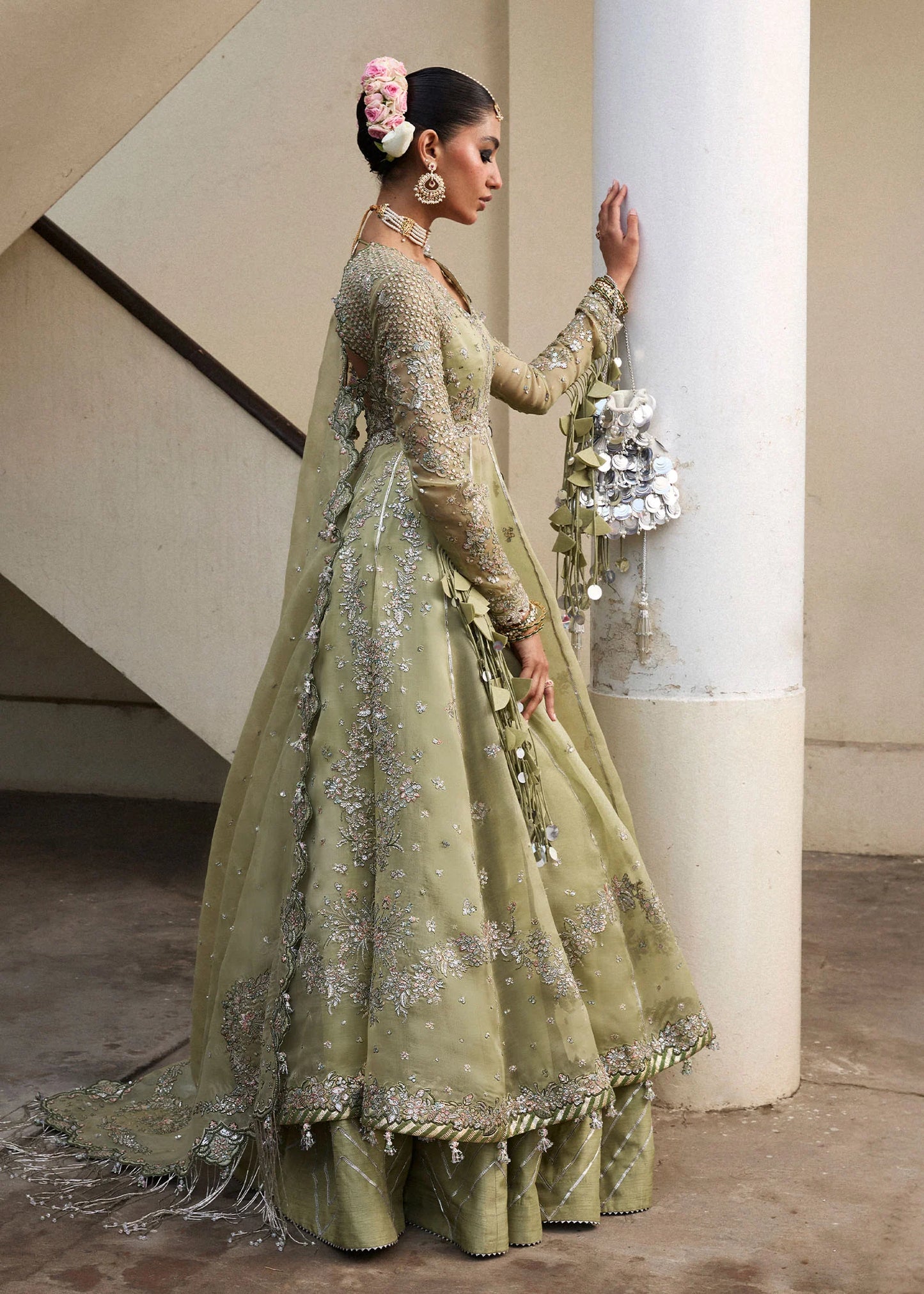 Model wearing Hussain Rehar Tahiri pastel green embroidered festive dress. Shop Pakistani clothes online in the UK for luxury occasion wear.
