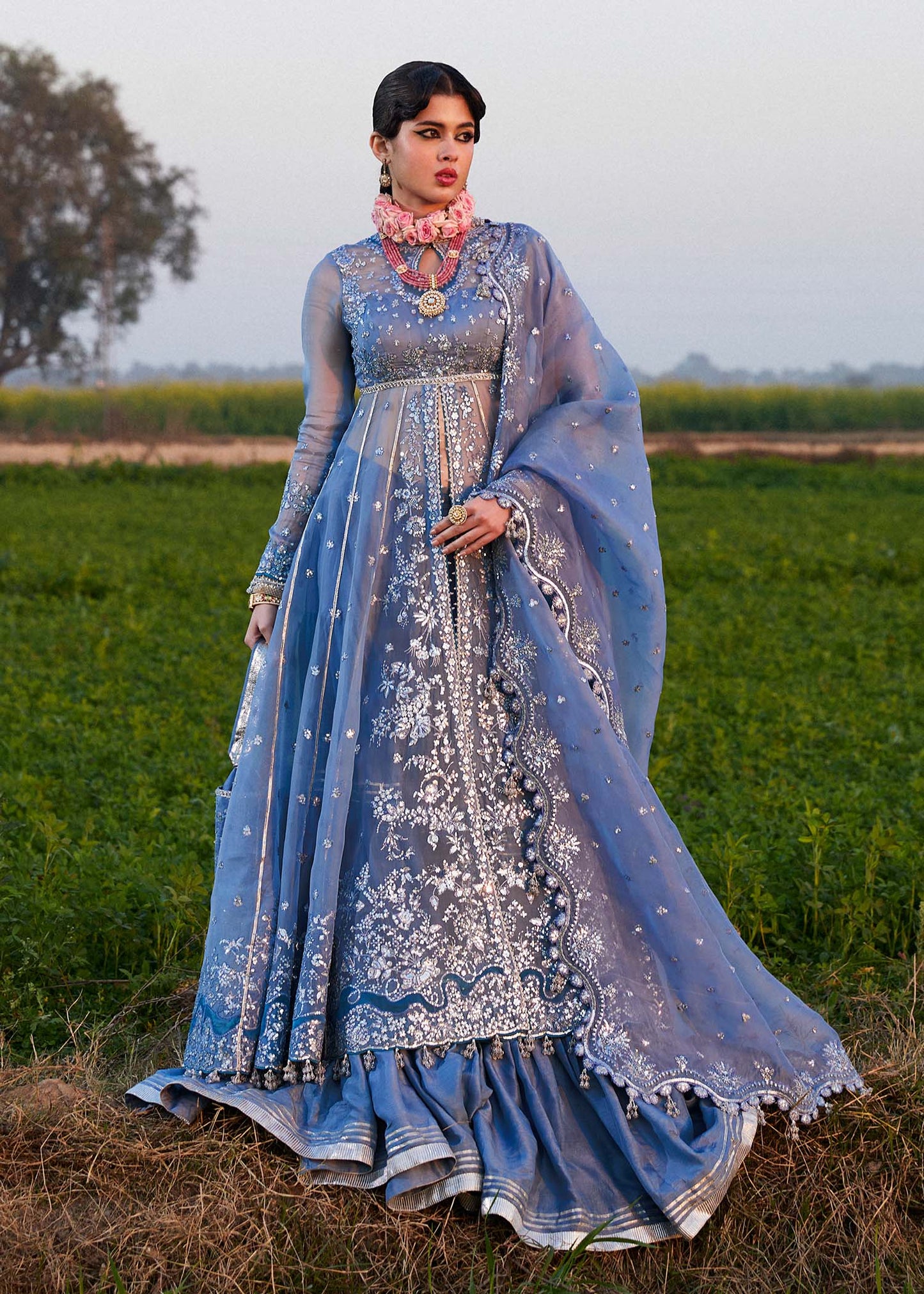 Model wearing Hussain Rehar Mira ice blue embroidered festive dress with intricate embellishments and elegant detailing. Shop Pakistani clothes online in the UK now.