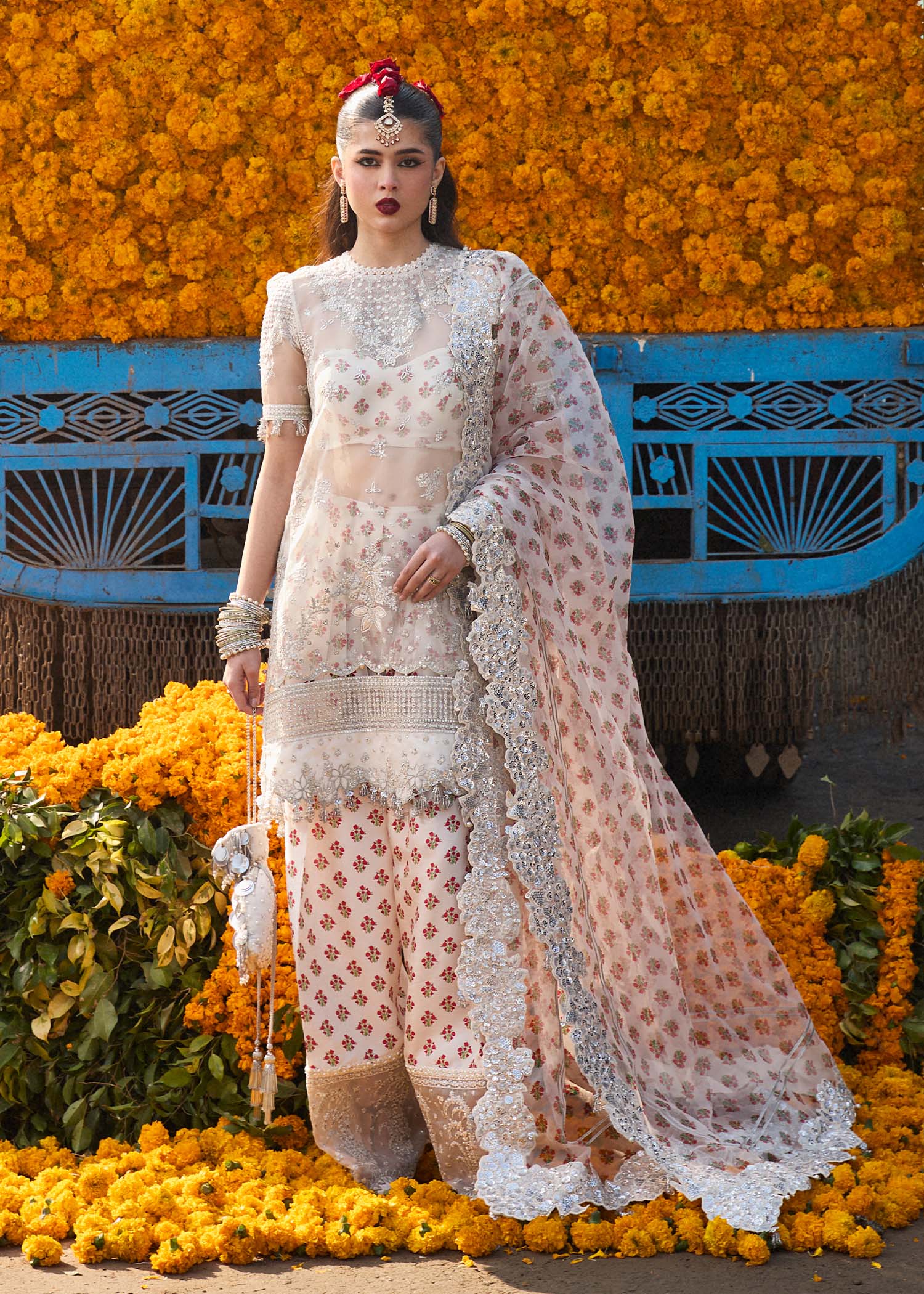 Model wearing Hussain Rehar Zareen ivory embroidered festive dress with floral details. Shop Pakistani clothes online in the UK now.