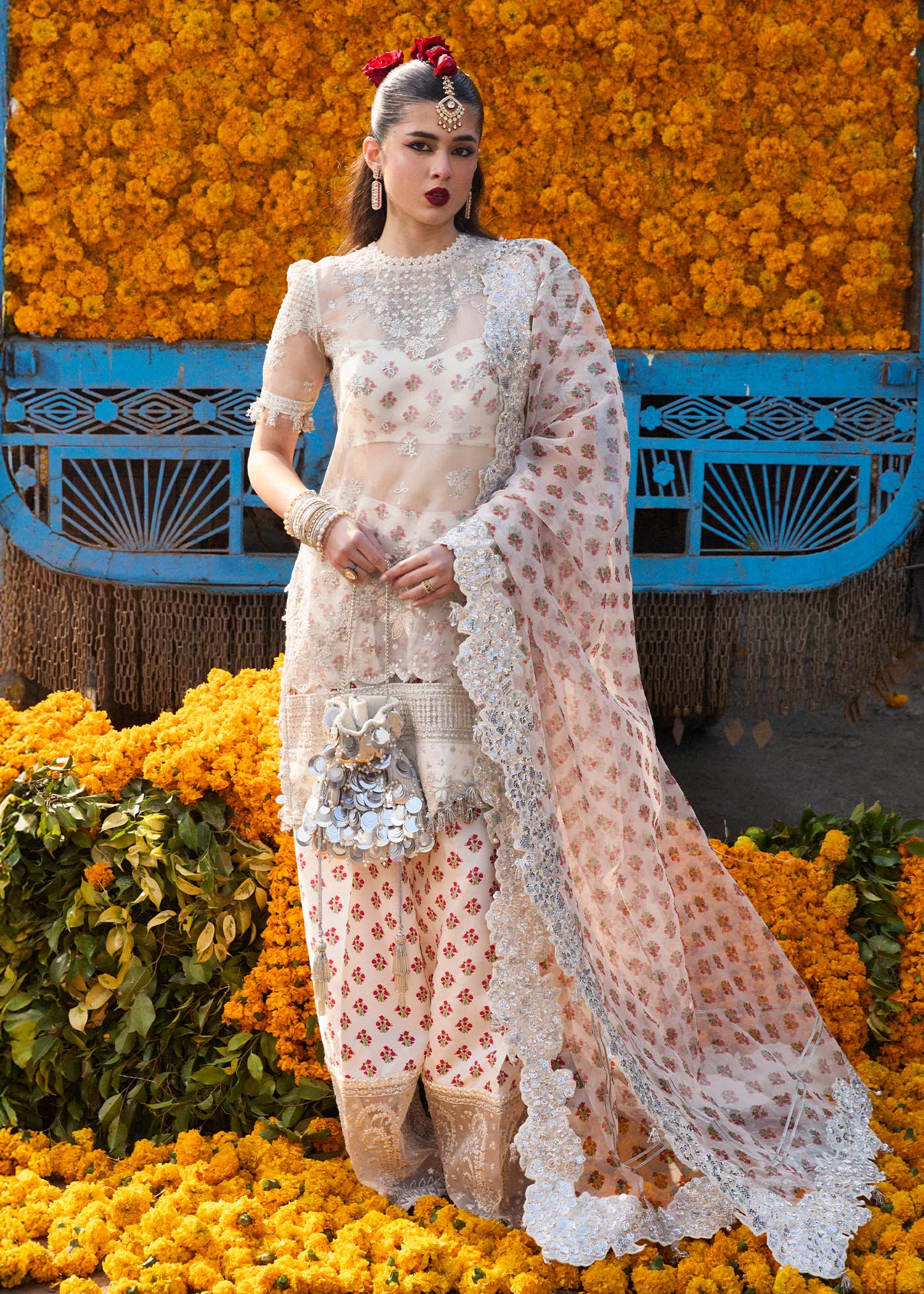 Model wearing Hussain Rehar Zareen ivory embroidered festive dress with floral details. Shop Pakistani clothes online in the UK now.