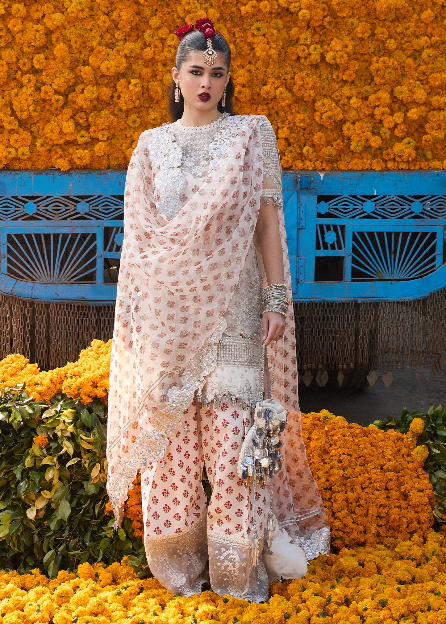 Model wearing Hussain Rehar Zareen ivory embroidered festive dress with floral details. Shop Pakistani clothes online in the UK now.