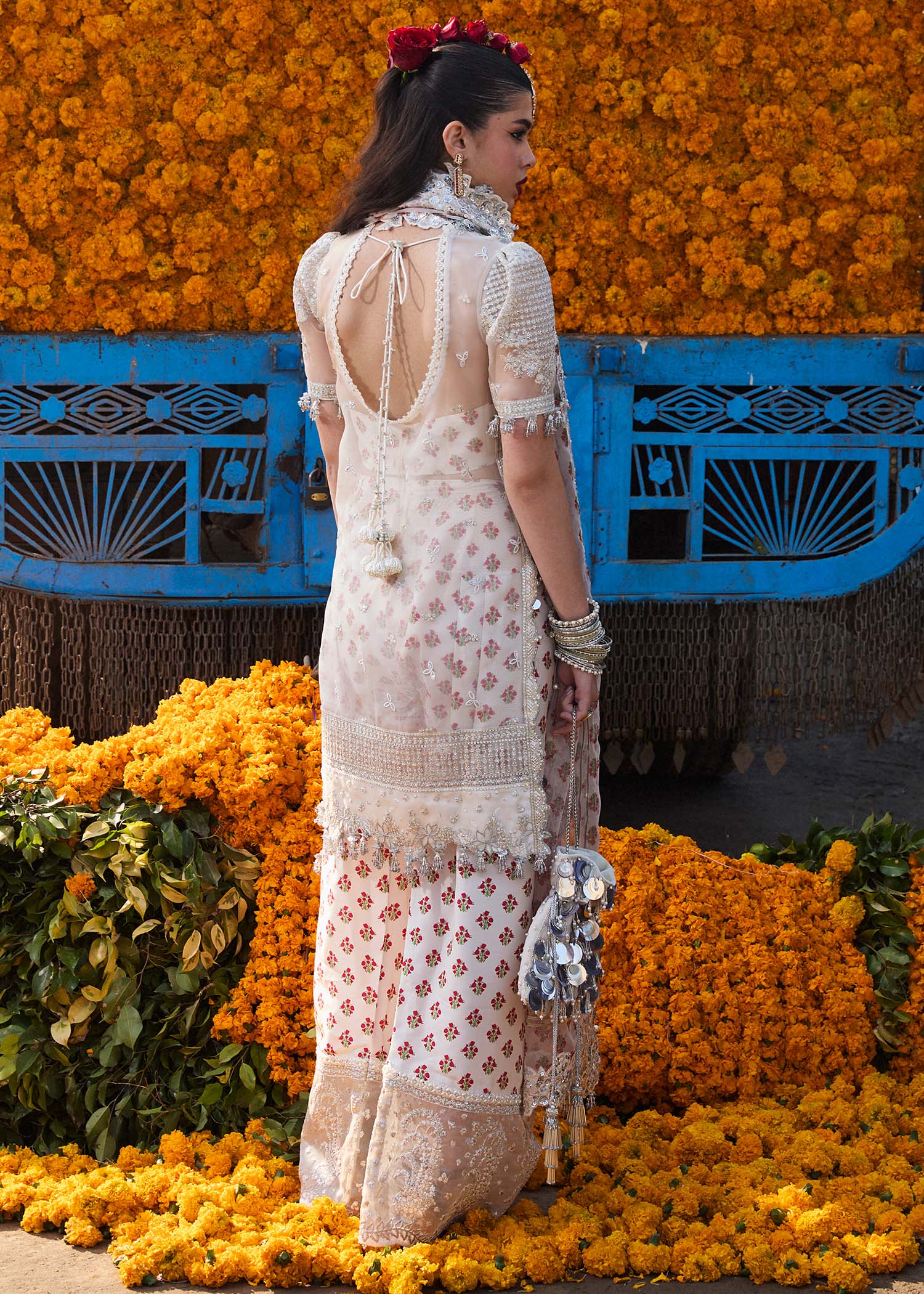 Model wearing Hussain Rehar Zareen ivory embroidered festive dress with floral details. Shop Pakistani clothes online in the UK now.