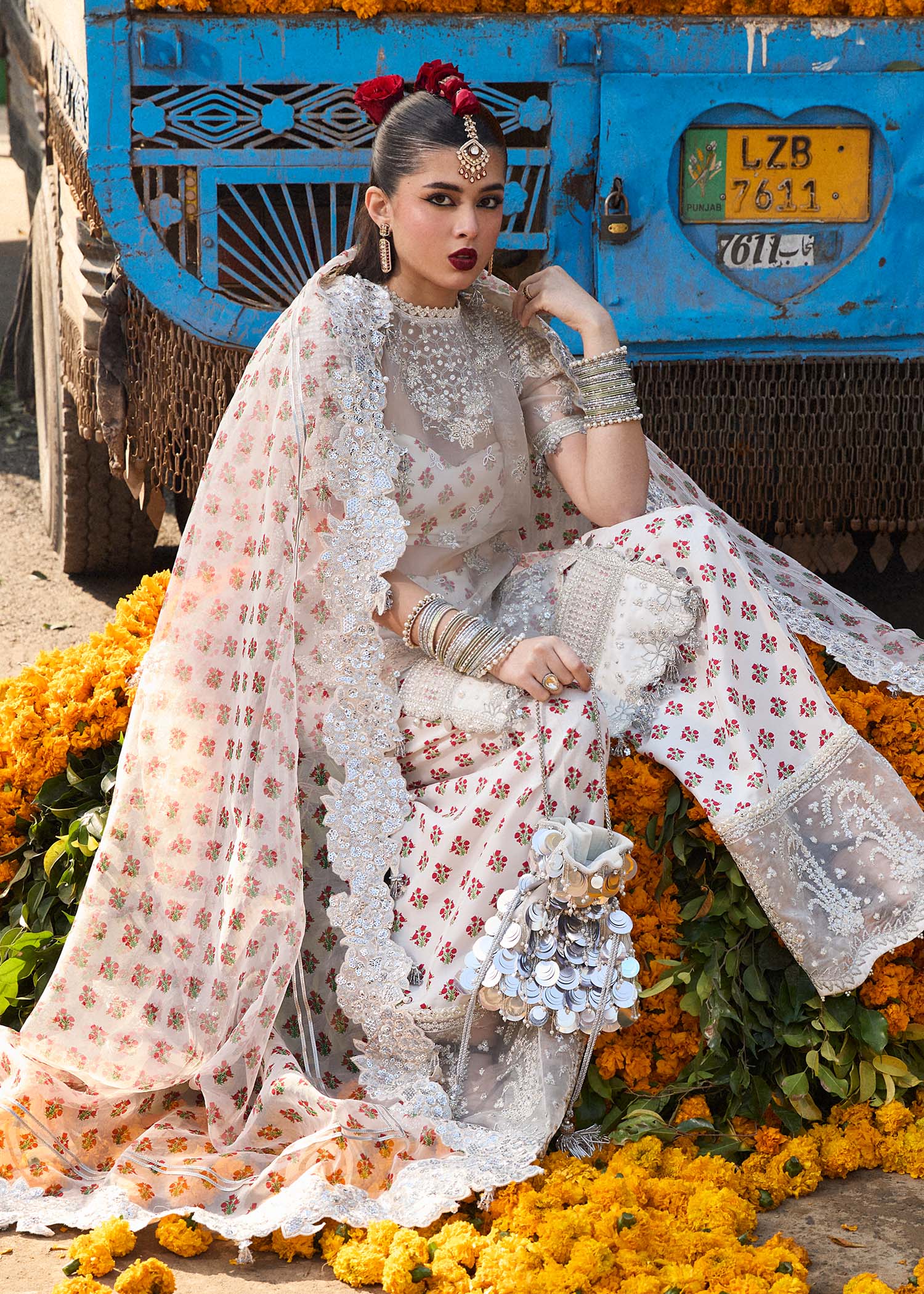 Model wearing Hussain Rehar Zareen ivory embroidered festive dress with floral details. Shop Pakistani clothes online in the UK now.