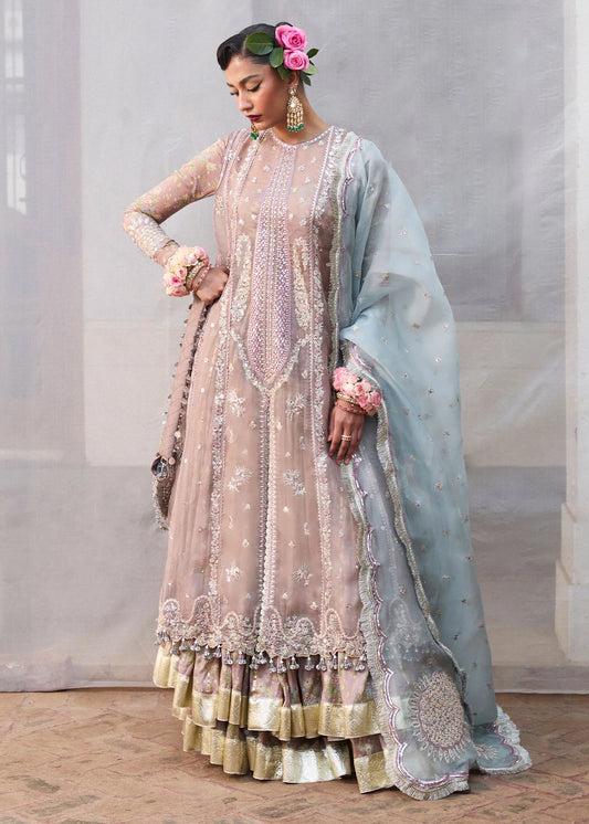 Model wearing Hussain Rehar Ziniya grey embroidered festive dress with intricate embellishments. Shop Pakistani clothes online in the UK now.