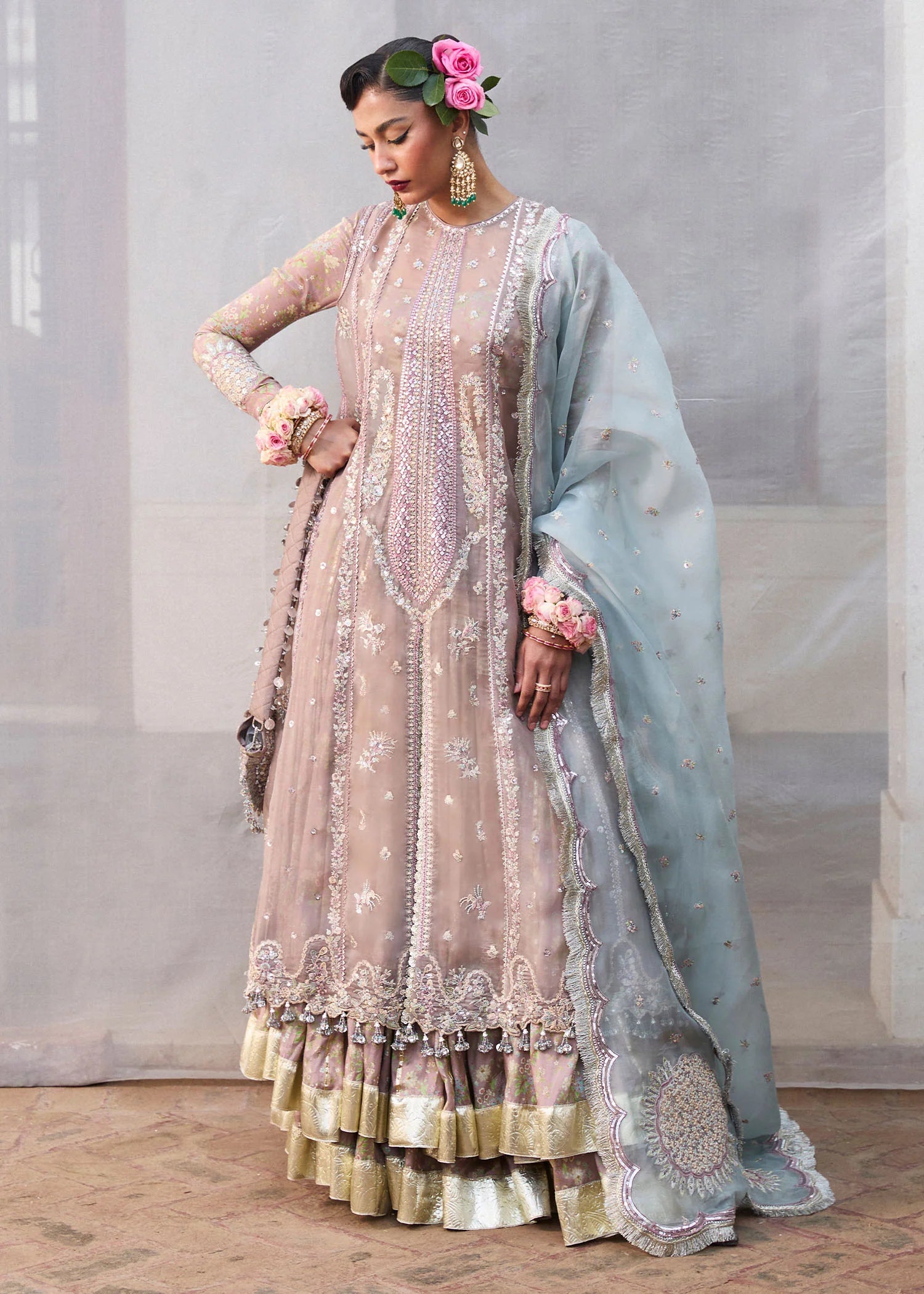 Model wearing Hussain Rehar Ziniya grey embroidered festive dress with intricate embellishments. Shop Pakistani clothes online in the UK now.
