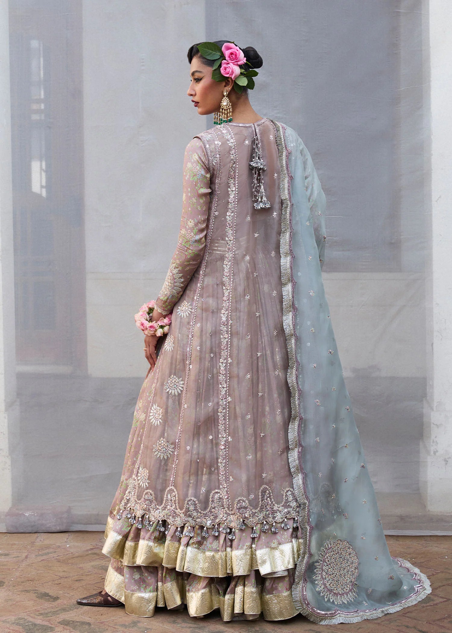 Model wearing Hussain Rehar Ziniya grey embroidered festive dress with intricate embellishments. Shop Pakistani clothes online in the UK now.
