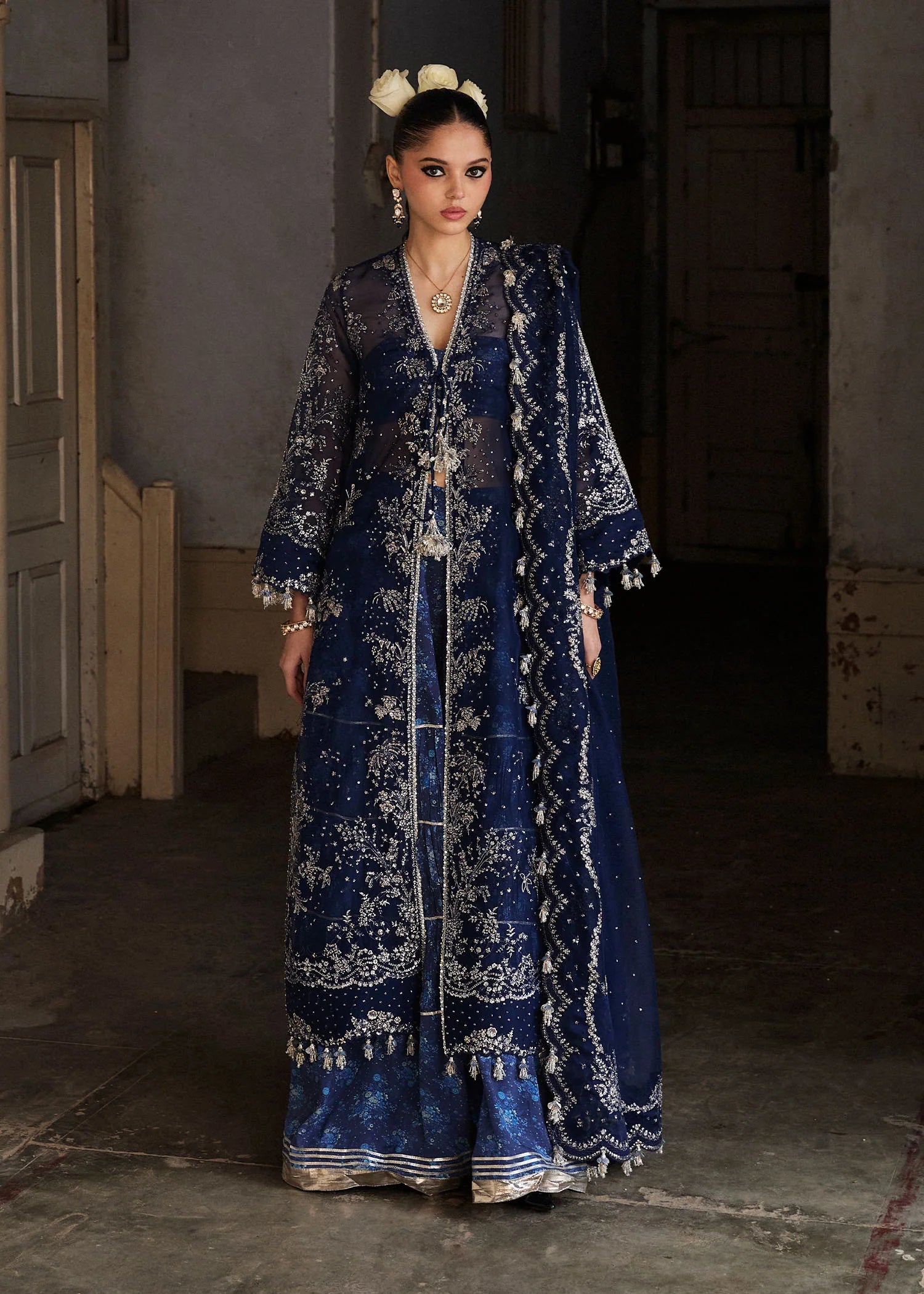 Model wearing Hussain Rehar Safa navy blue embroidered festive dress with intricate embellishments and sheer details. Shop Pakistani clothes online in the UK now.