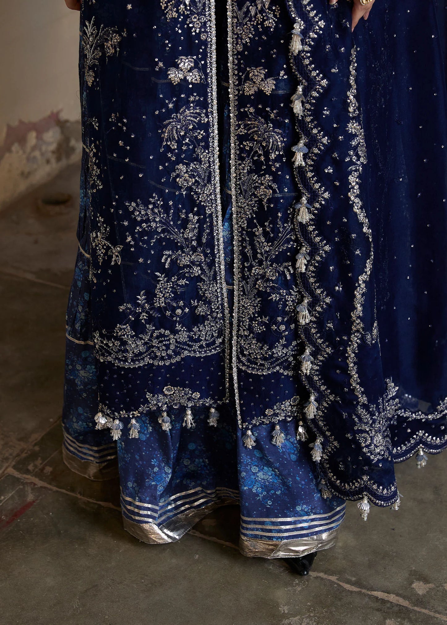 Model wearing Hussain Rehar Safa navy blue embroidered festive dress with intricate embellishments and sheer details. Shop Pakistani clothes online in the UK now.