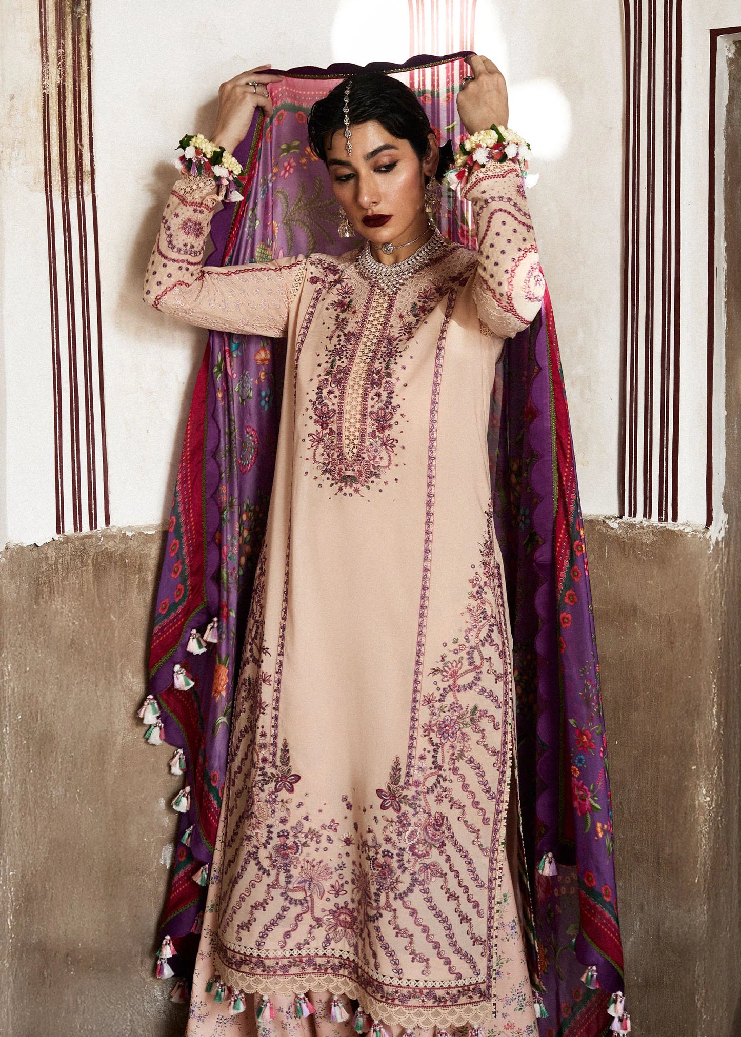 Model wearing peach and plum Lehr from Hussain Rehar Nirmal SS '25, Pakistani luxury pret and Pakistani clothes online in UK.