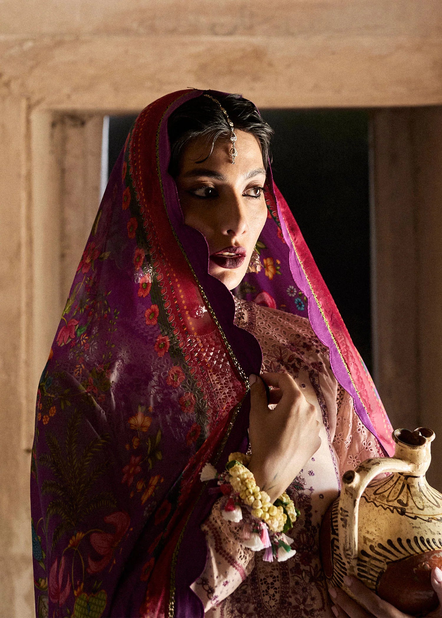 Model wearing peach and plum Lehr from Hussain Rehar Nirmal SS '25, Pakistani luxury pret and Pakistani clothes online in UK.