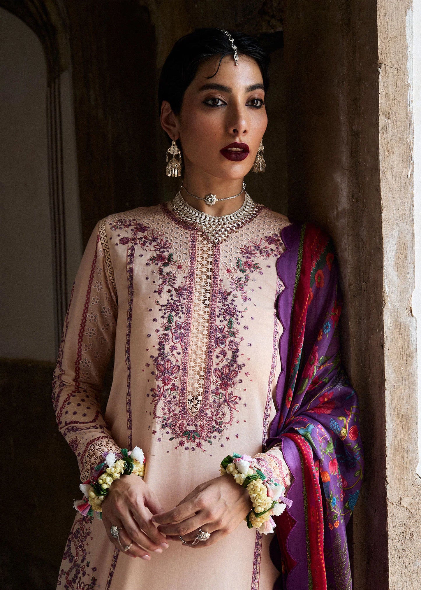 Model wearing peach and plum Lehr from Hussain Rehar Nirmal SS '25, Pakistani luxury pret and Pakistani clothes online in UK.