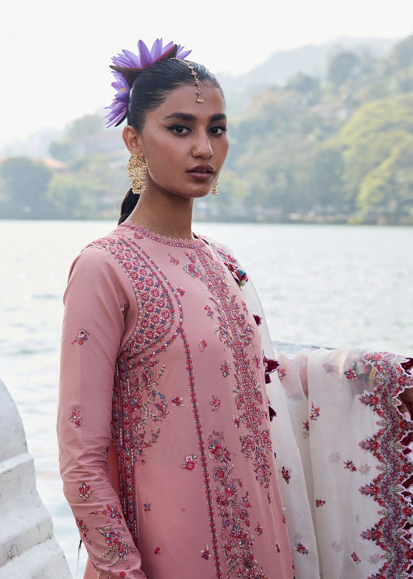 Model wearing Hussain Rehar Luxury Lawn '25 Peaar in blush pink with intricate embroidery. Shop Pakistani luxury pret online in the UK.