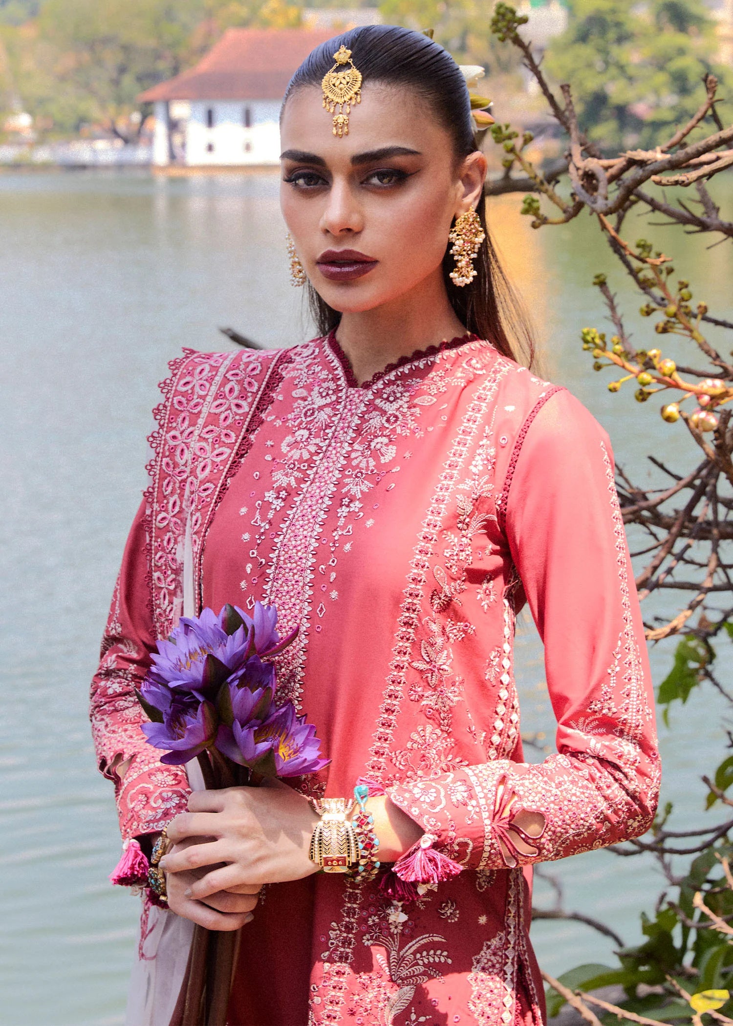 Model wearing Hussain Rehar Luxury Lawn '25 Flare in dark coral with intricate embroidery. Shop Pakistani luxury pret online in the UK.