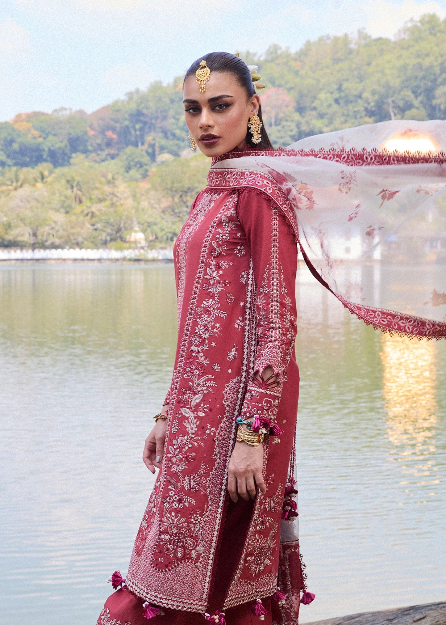 Model wearing Hussain Rehar Luxury Lawn '25 Flare in dark coral with intricate embroidery. Shop Pakistani luxury pret online in the UK.