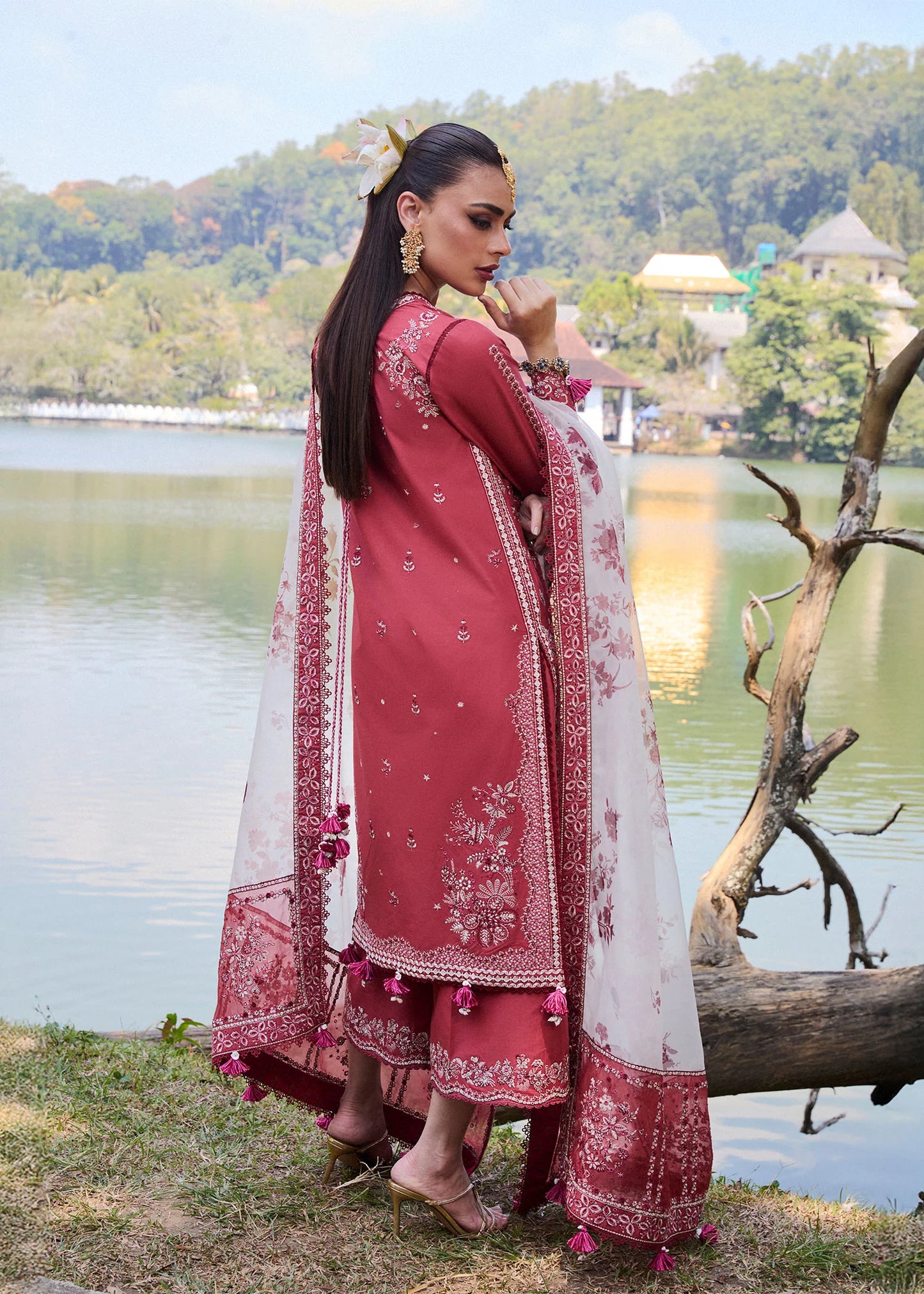 Model wearing Hussain Rehar Luxury Lawn '25 Flare in dark coral with intricate embroidery. Shop Pakistani luxury pret online in the UK.