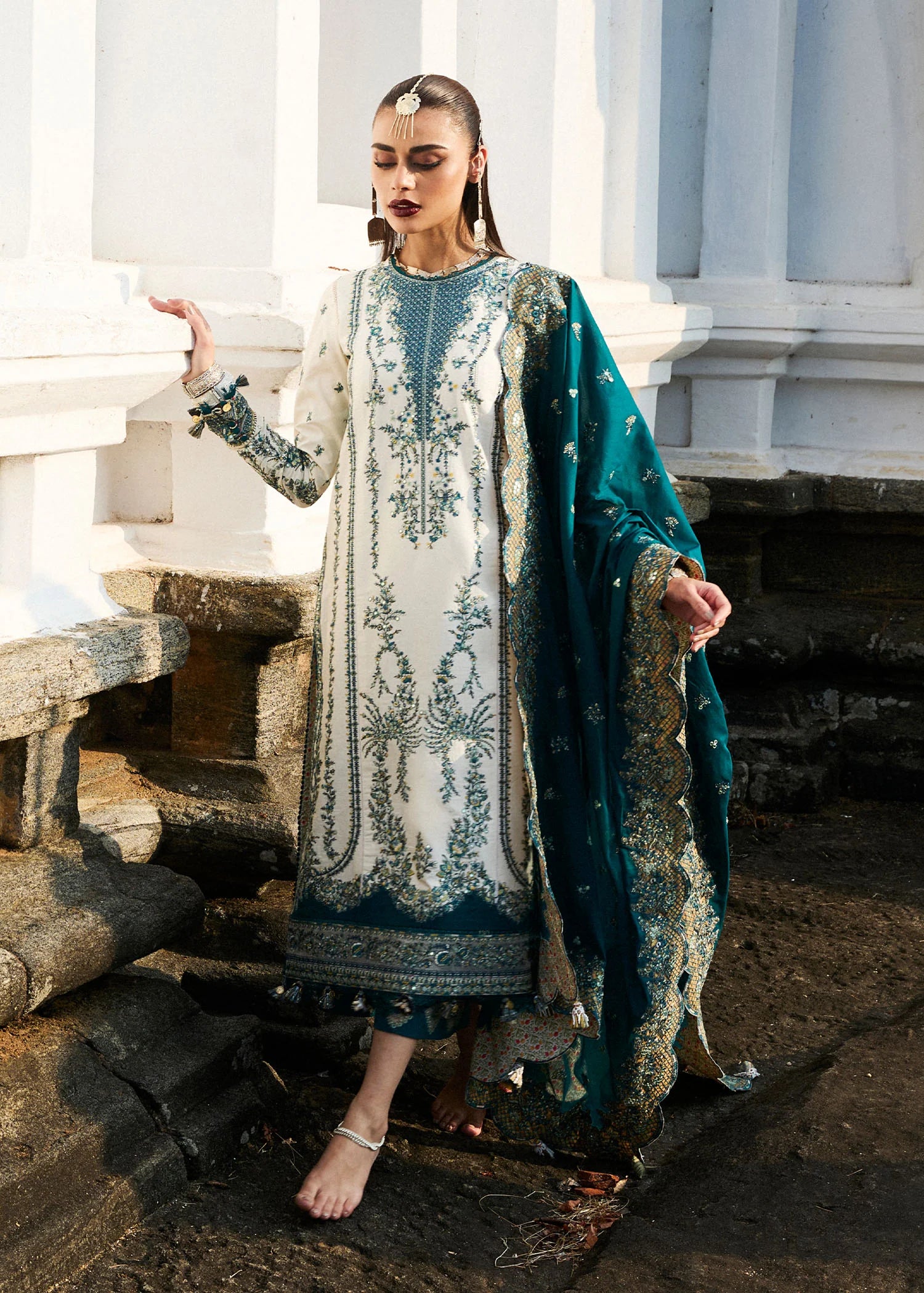 Model wearing Hussain Rehar Luxury Lawn '25 Veil in ivory with teal embroidery. Shop Pakistani luxury pret online in the UK.