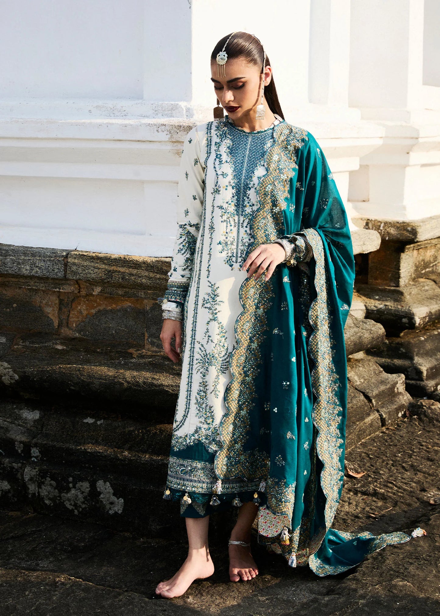 Model wearing Hussain Rehar Luxury Lawn '25 Veil in ivory with teal embroidery. Shop Pakistani luxury pret online in the UK.