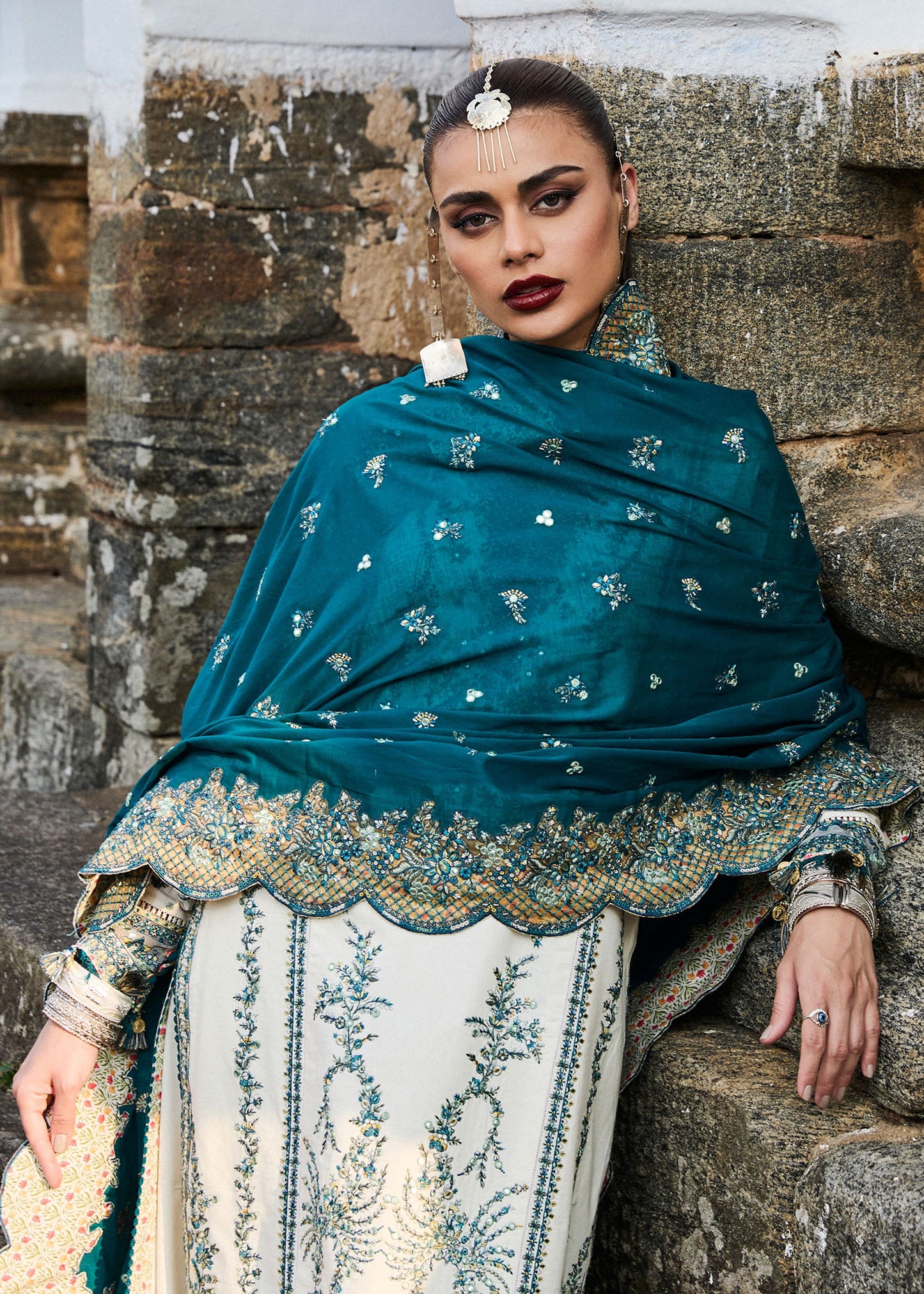 Model wearing Hussain Rehar Luxury Lawn '25 Veil in ivory with teal embroidery. Shop Pakistani luxury pret online in the UK.