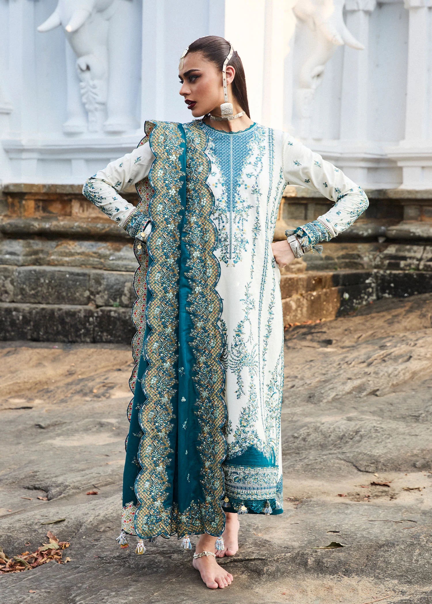 Model wearing Hussain Rehar Luxury Lawn '25 Veil in ivory with teal embroidery. Shop Pakistani luxury pret online in the UK.