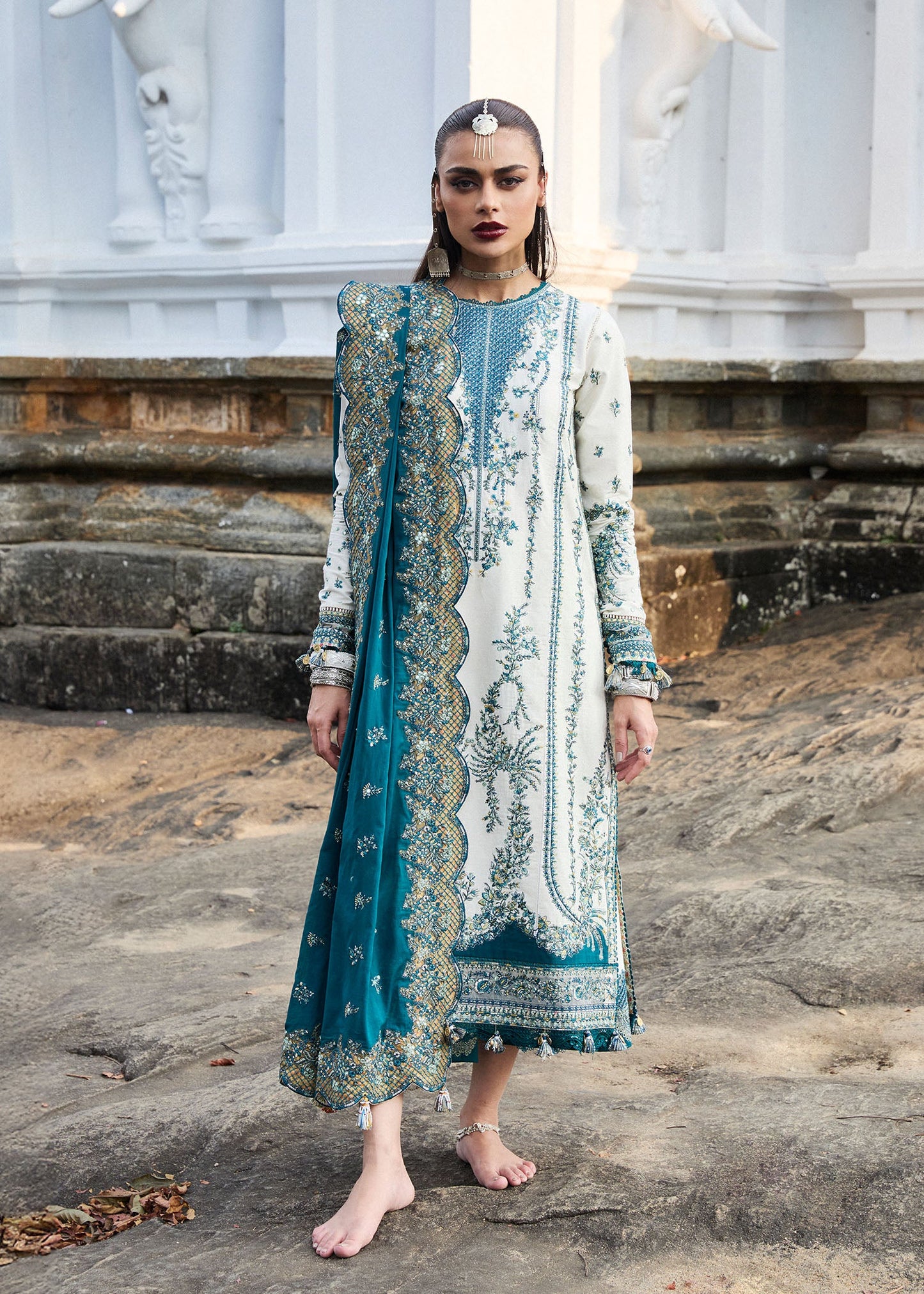 Model wearing Hussain Rehar Luxury Lawn '25 Veil in ivory with teal embroidery. Shop Pakistani luxury pret online in the UK.