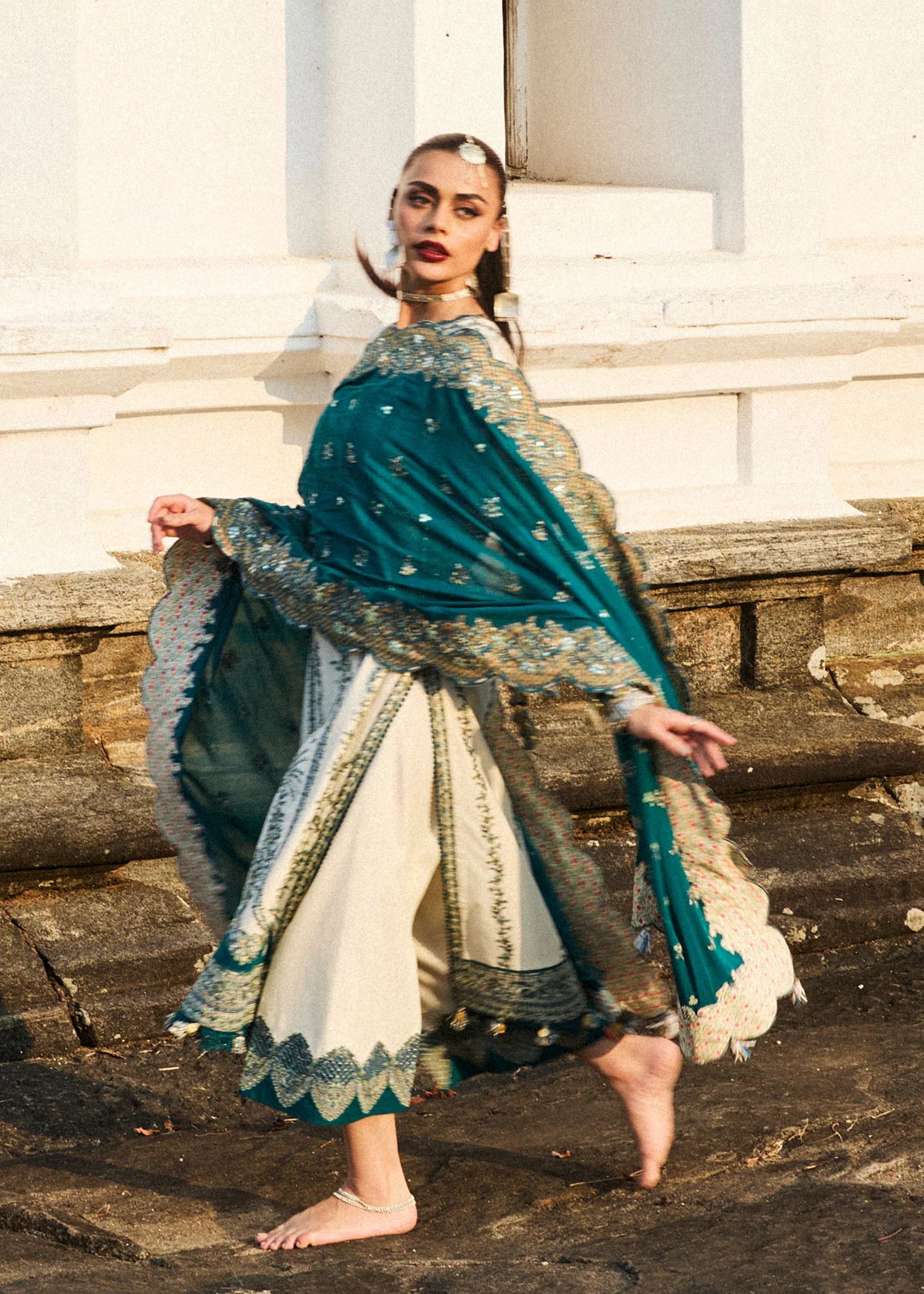 Model wearing Hussain Rehar Luxury Lawn '25 Veil in ivory with teal embroidery. Shop Pakistani luxury pret online in the UK.