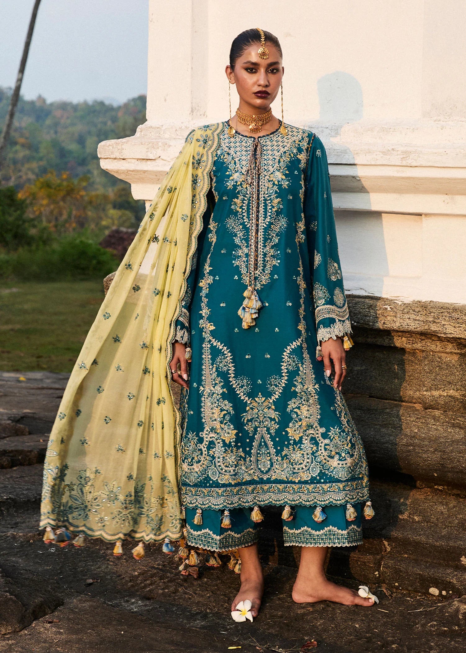 Model wearing Hussain Rehar Luxury Lawn '25 Eupic in teal blue with intricate embroidery. Shop Pakistani luxury pret online in the UK.