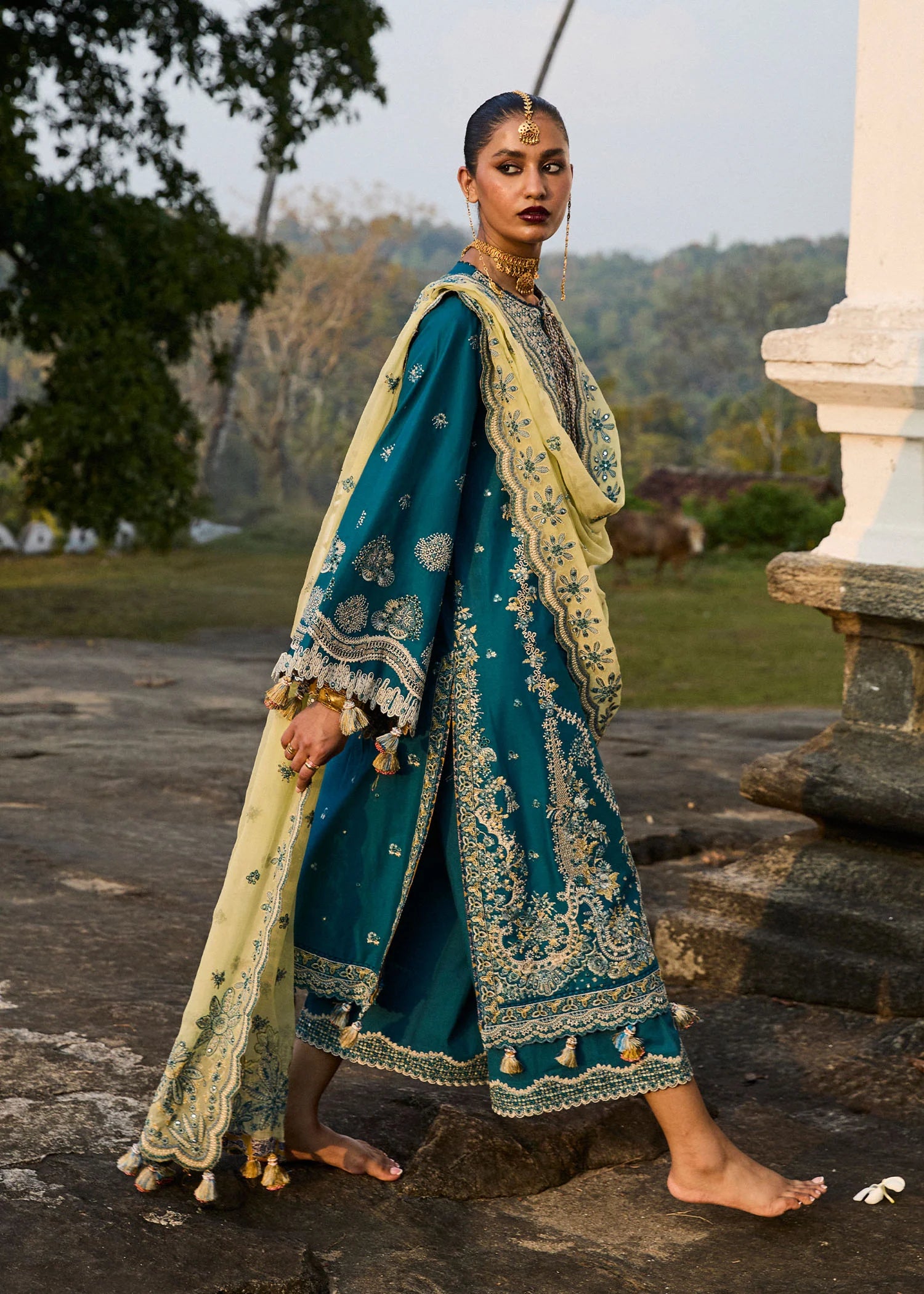 Model wearing Hussain Rehar Luxury Lawn '25 Eupic in teal blue with intricate embroidery. Shop Pakistani luxury pret online in the UK.