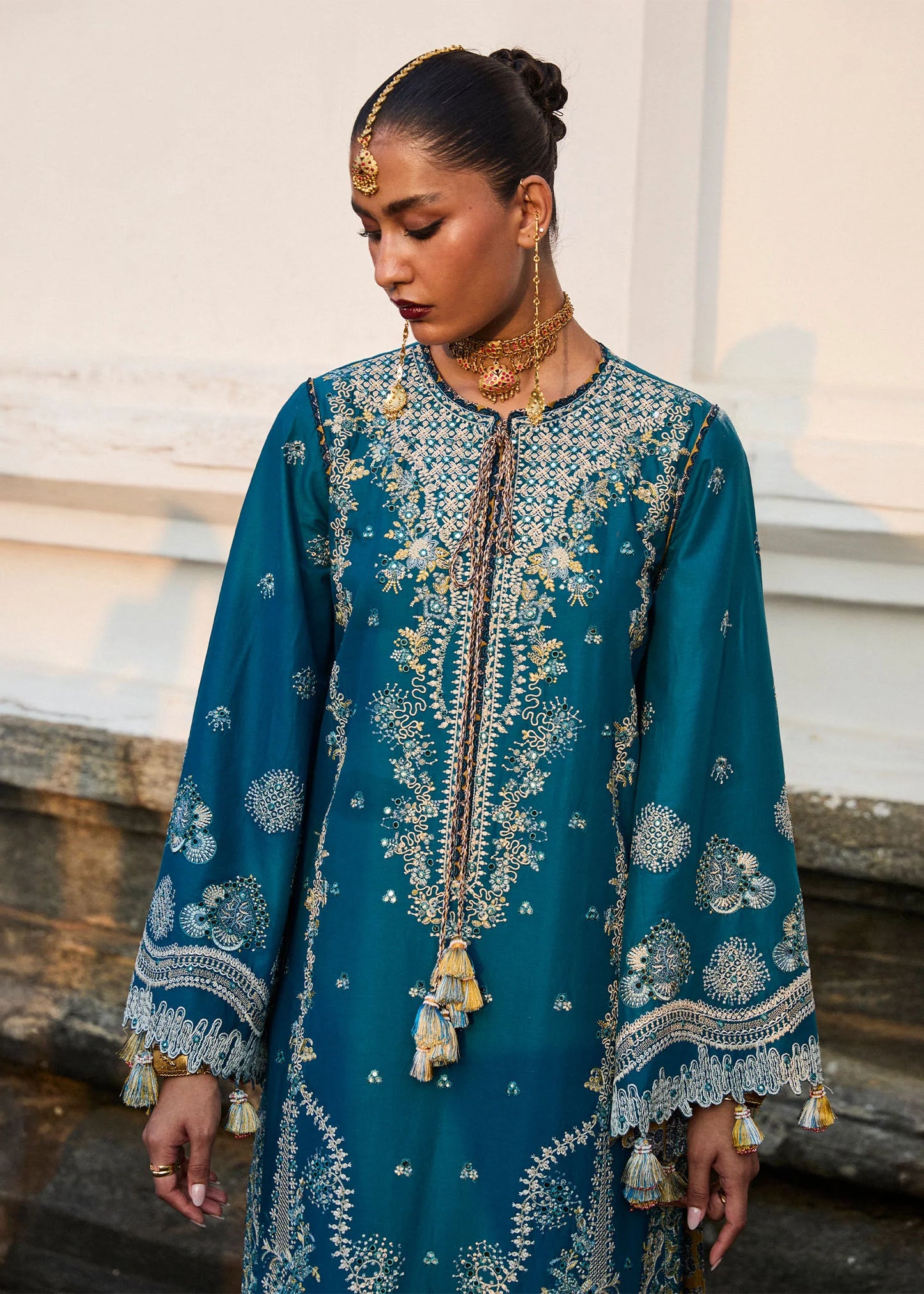 Model wearing Hussain Rehar Luxury Lawn '25 Eupic in teal blue with intricate embroidery. Shop Pakistani luxury pret online in the UK.